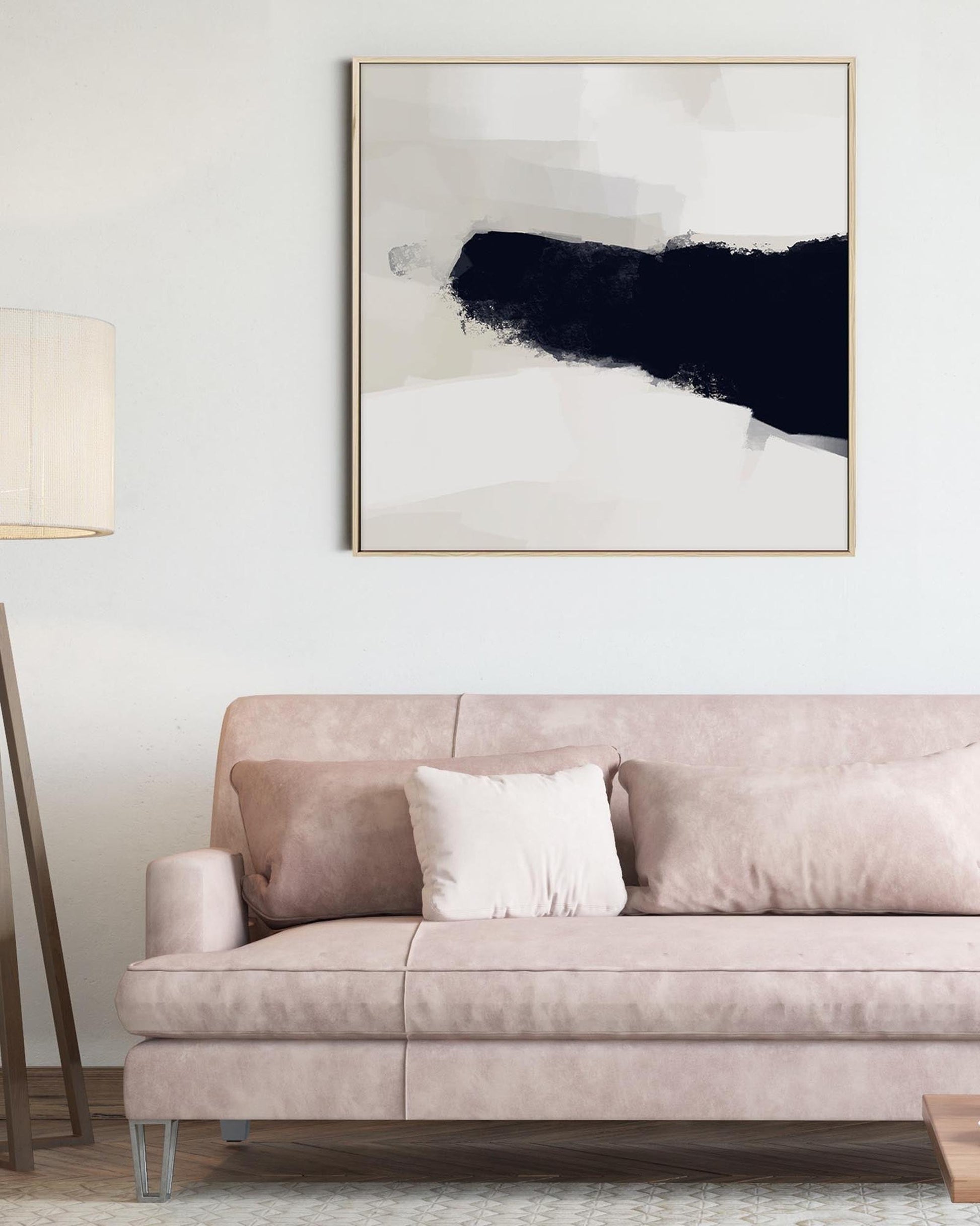 Sofa with a abstract painting above it in a living room setting