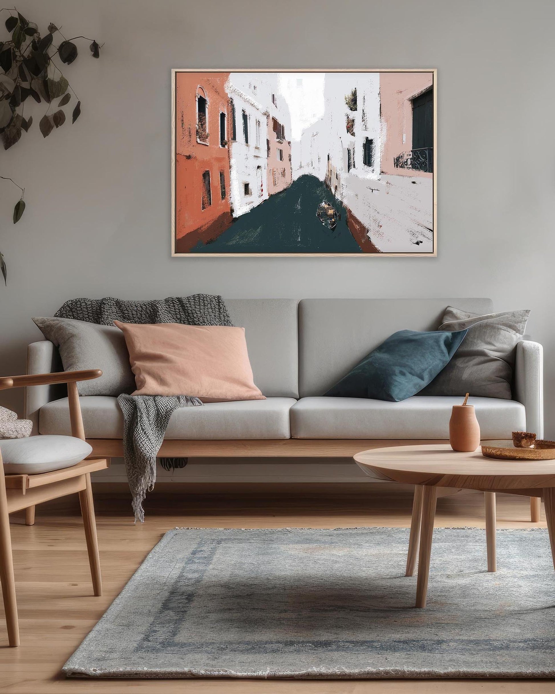 Living room with a gray sofa, wooden coffee table, and abstract painting on the wall.
