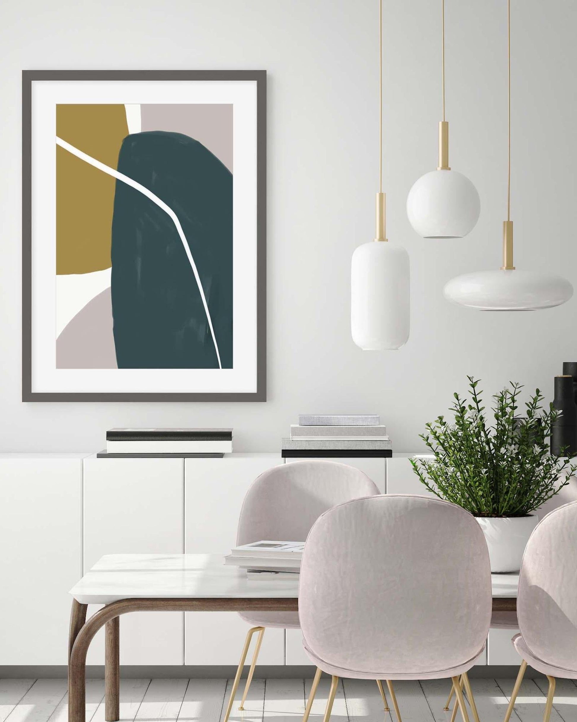 Modern dining room with abstract art, white pendant lights, and a plant.