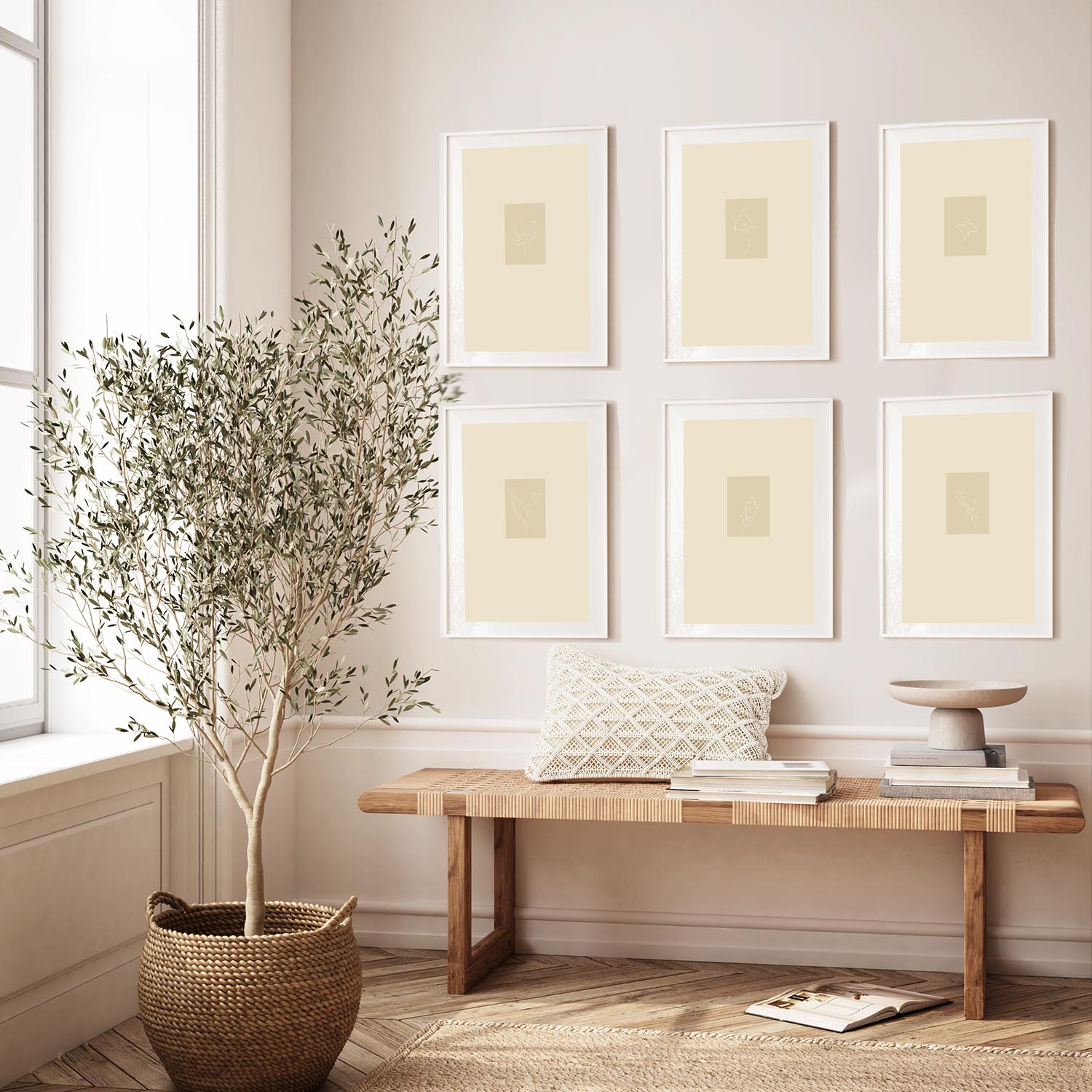 a set of 6 framed prints on the wall above a bench in a styled room with a potted tree