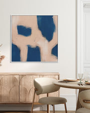 Modern interior with abstract art, wooden cabinet, and dining table.