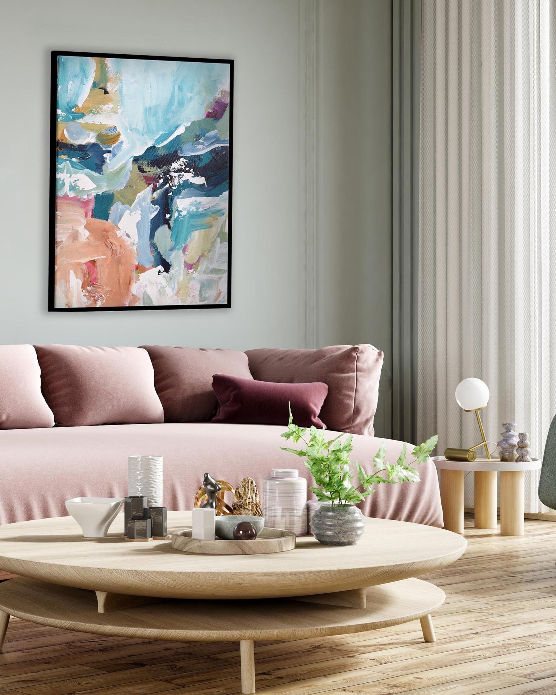 Modern living room with a pink sofa, round coffee table, and abstract art on the wall.
