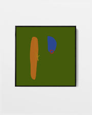 A framed abstract art print featuring a dark olive green background with a textured vertical orange shape, a blue shape, and a small red ring, displayed on a light gray wall.