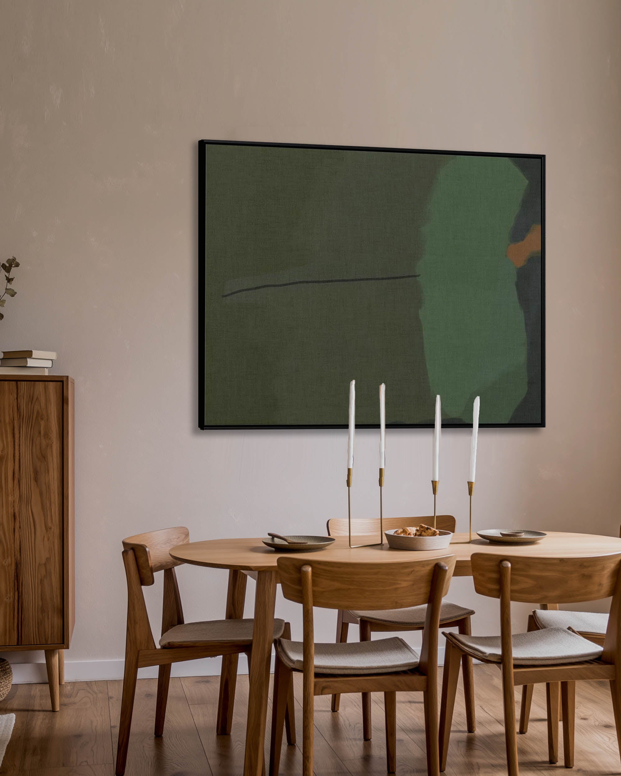 Dining room with wooden table and chairs, abstract painting on the wall.