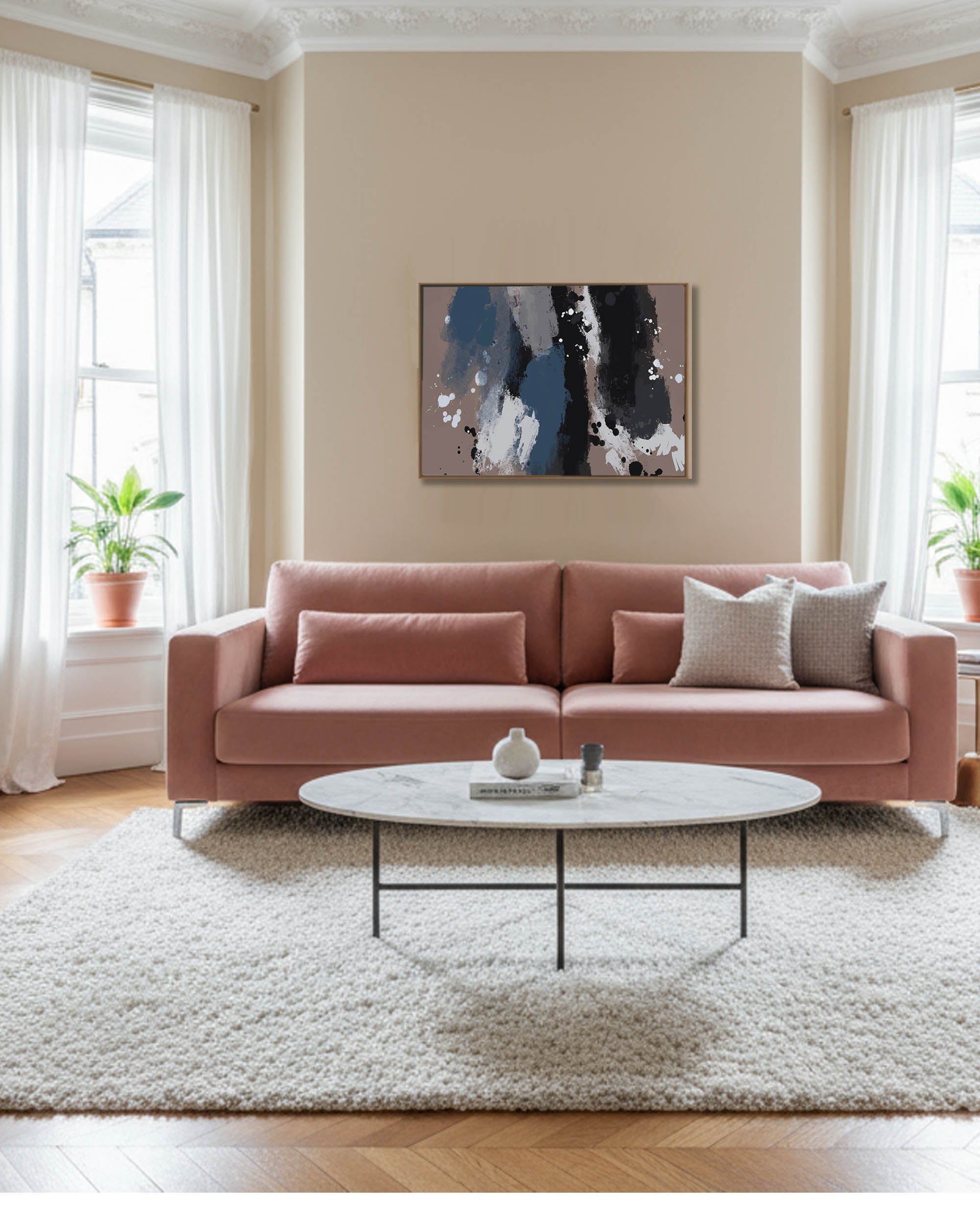Living room with a pink sofa, round coffee table, and abstract painting on the wall.