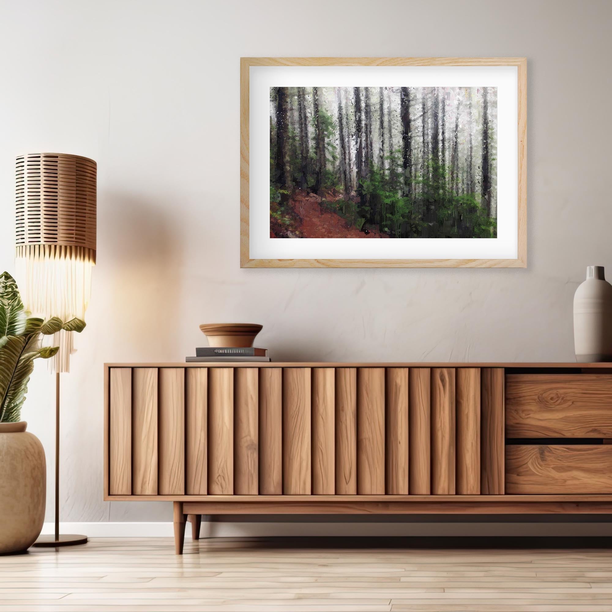 a framed wall art print on a wall above a sideboard 