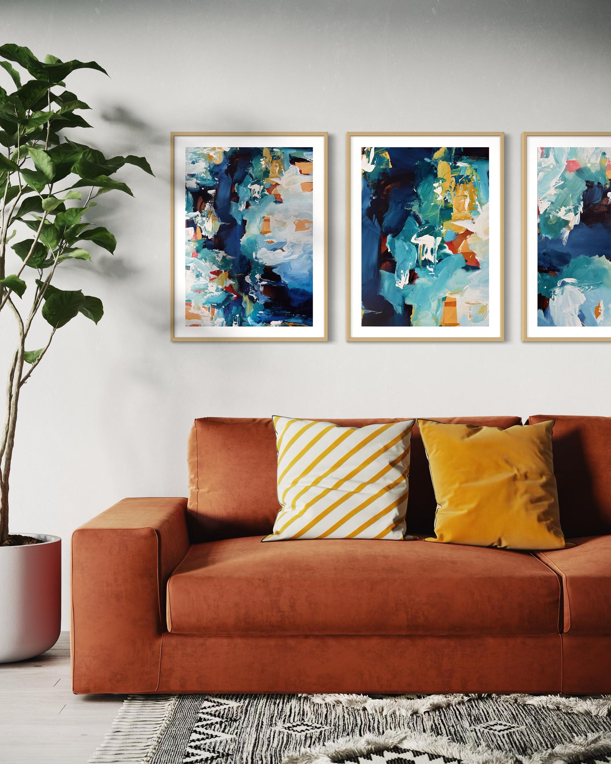 Living room with a brown sofa, abstract art on the wall, and decorative pillows.