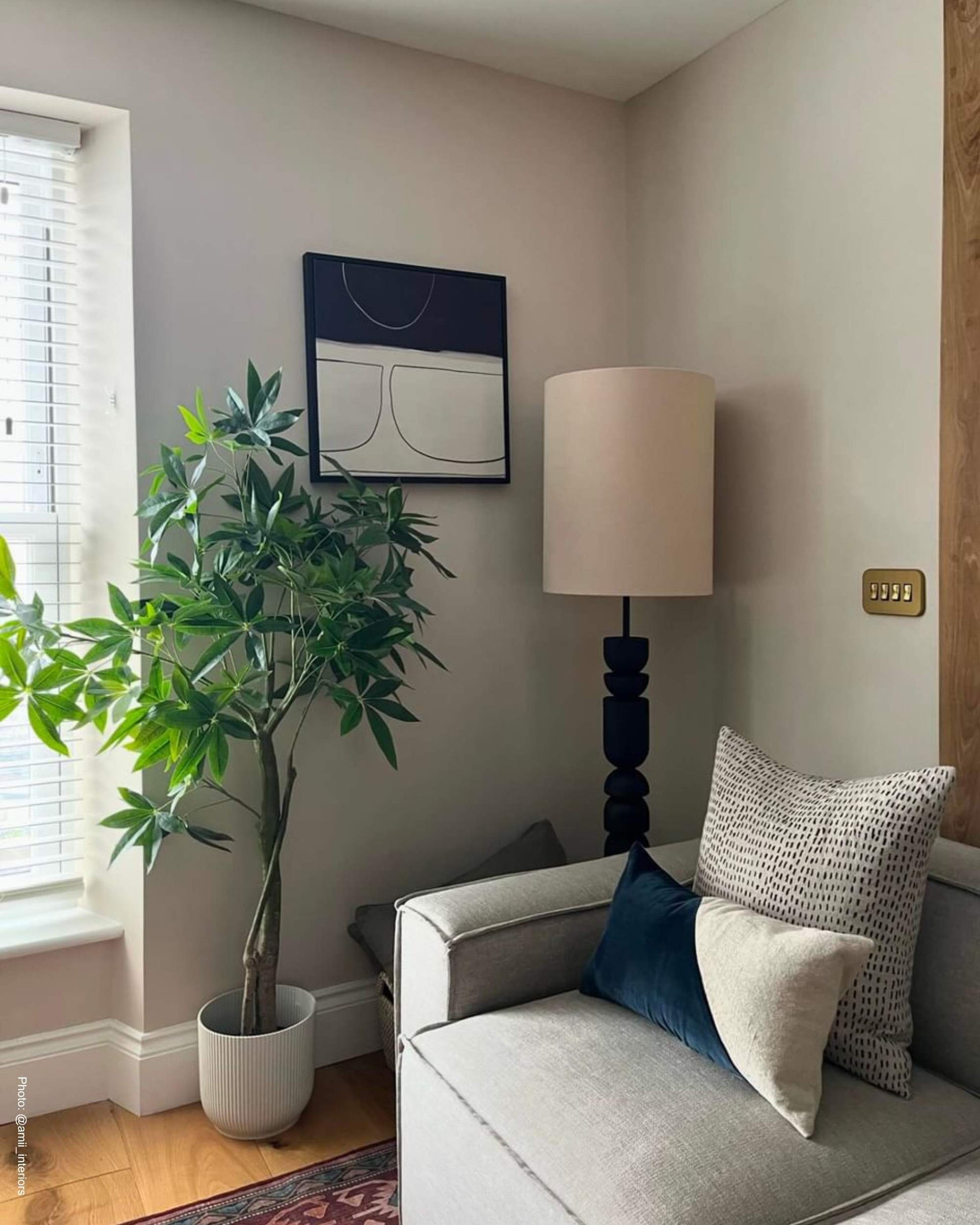 Modern scandinavian living room with neutral grey and black abstract canvas wall art on wall