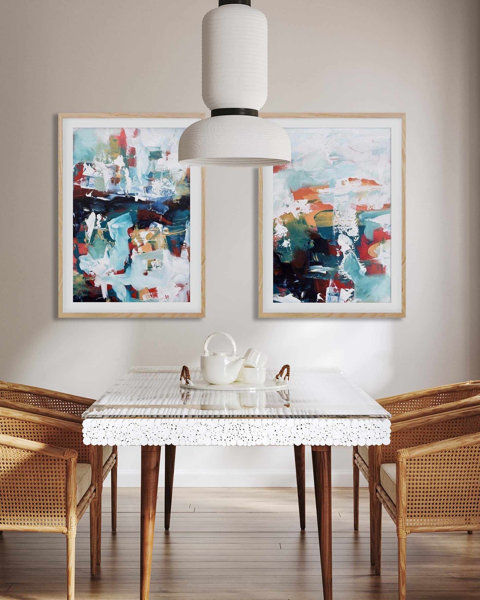 Dining room with abstract art on the wall, a glass table, and wooden chairs.