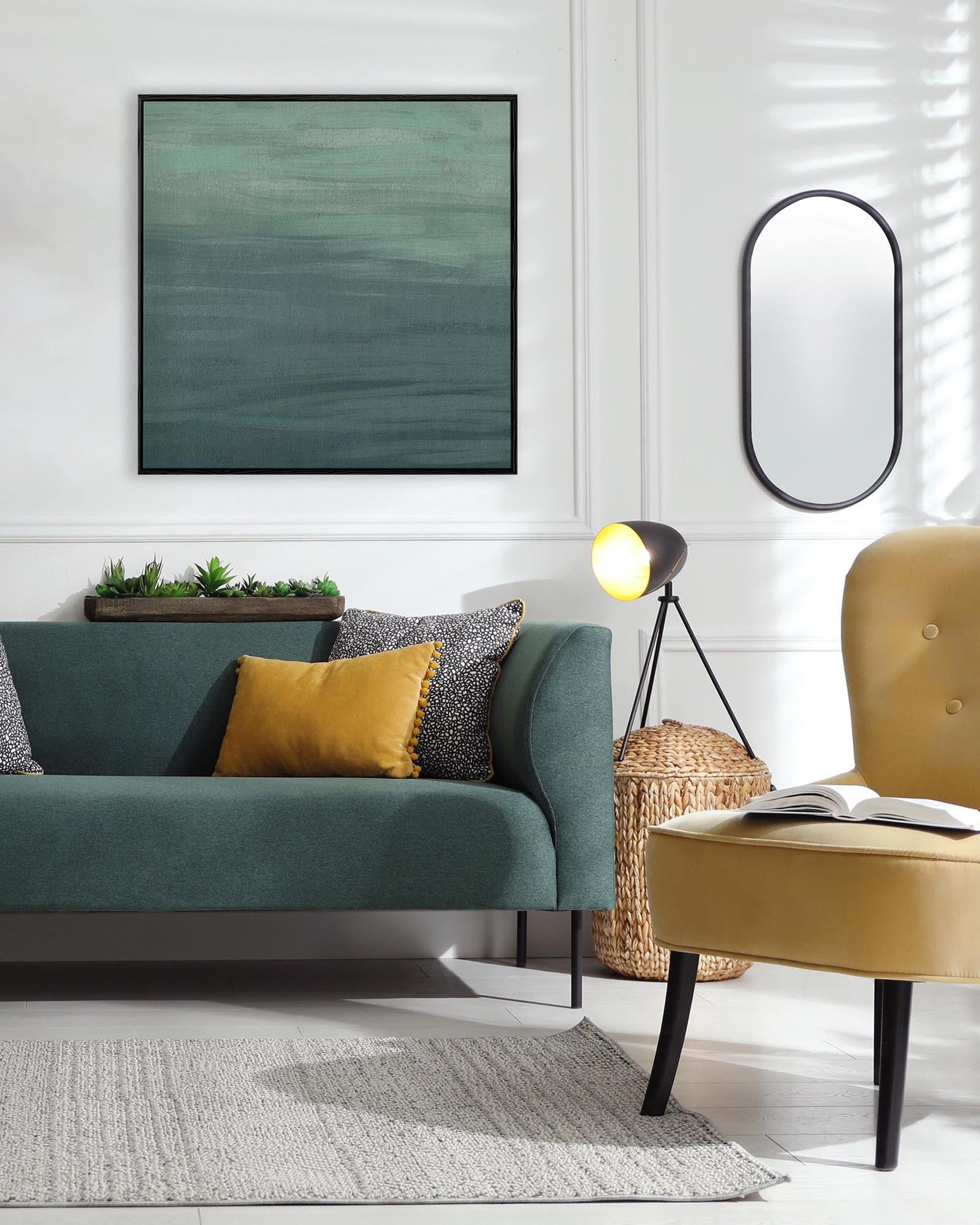 Modern living room with a teal sofa, yellow chair, and decorative elements.