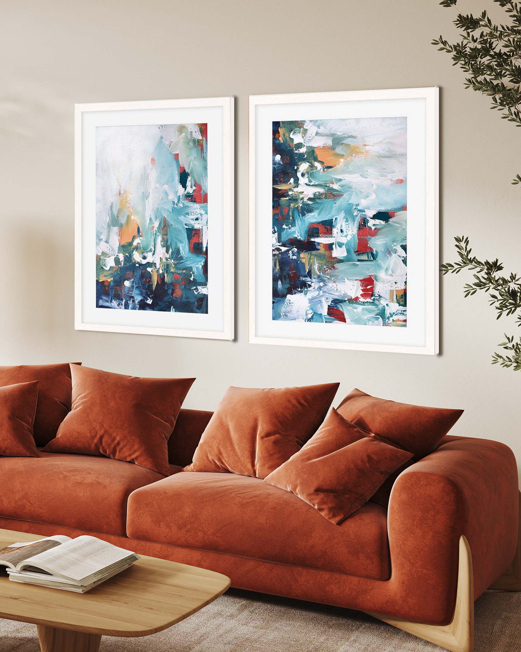 modern blue abstract wall art prints framed in white frames above burnt orange large 3 seater sofa in modern living room