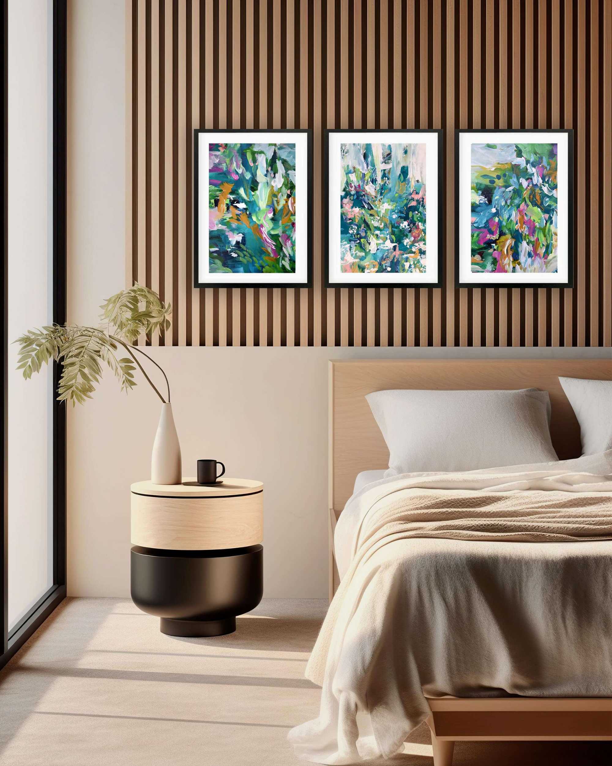 bright colourful painting prints abstract wall art British artist hung in modern stylish bedroom