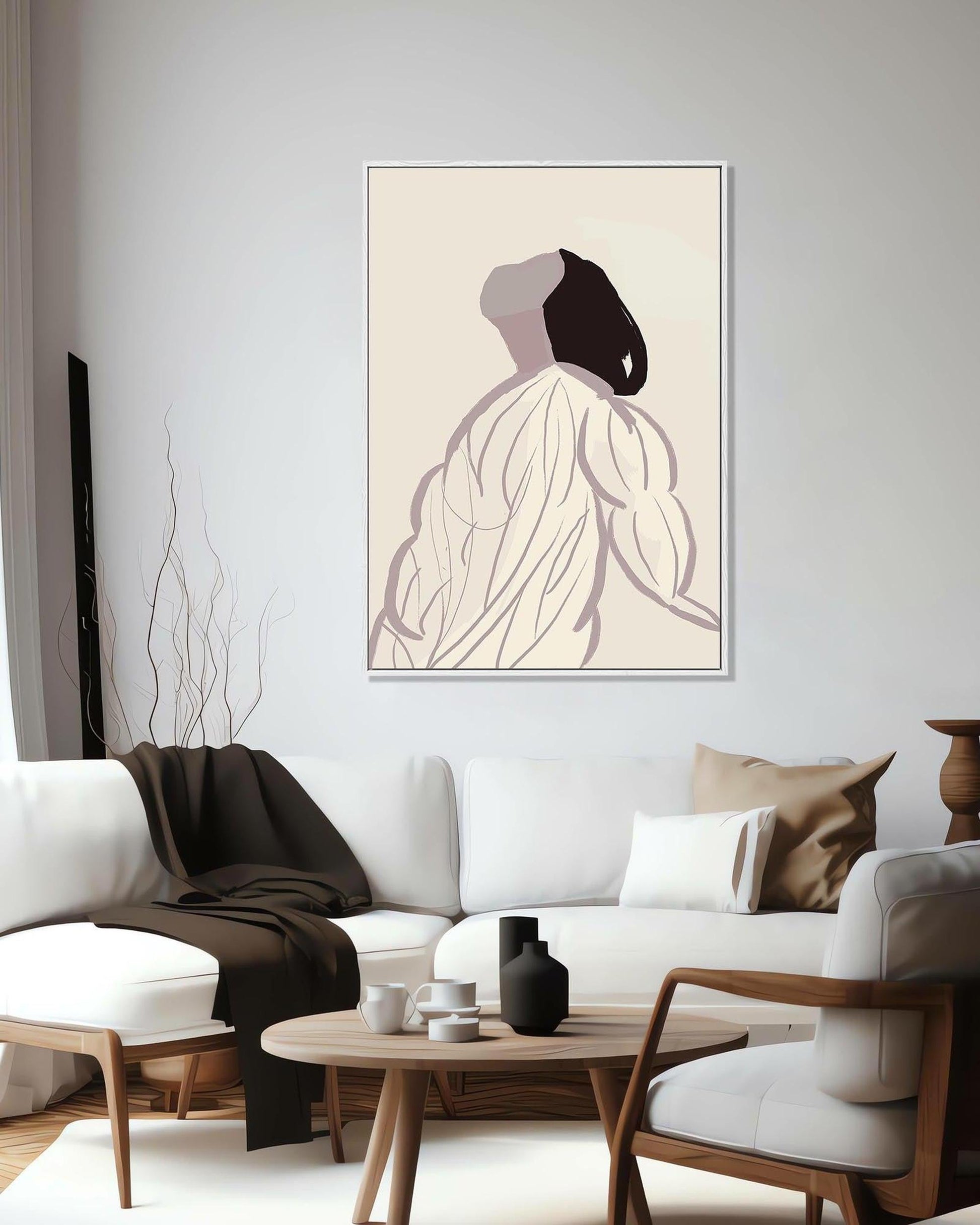 Modern living room with a white sofa, wooden coffee table, and abstract art on the wall.