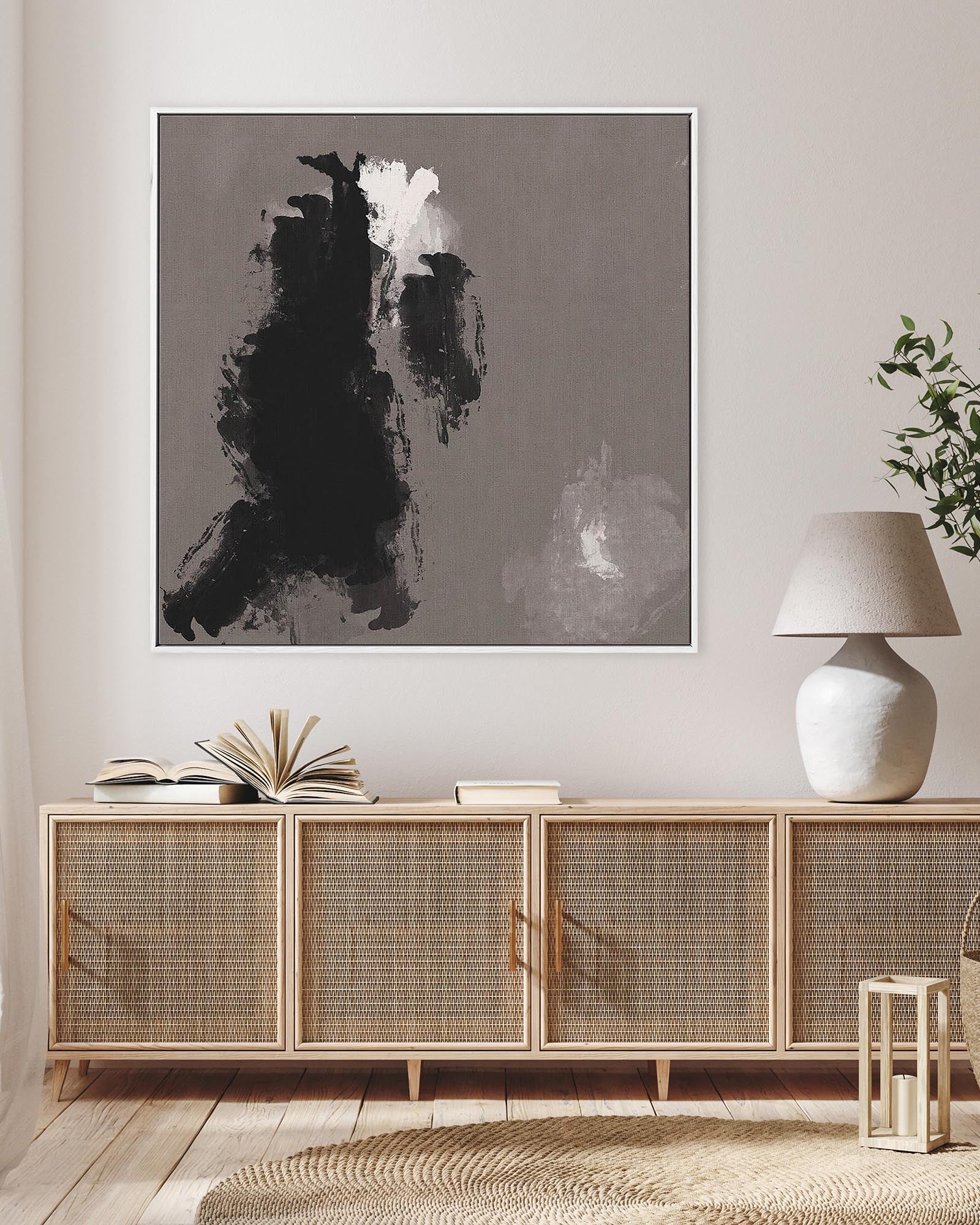 Modern interior with a sideboard, abstract art, and decorative items.