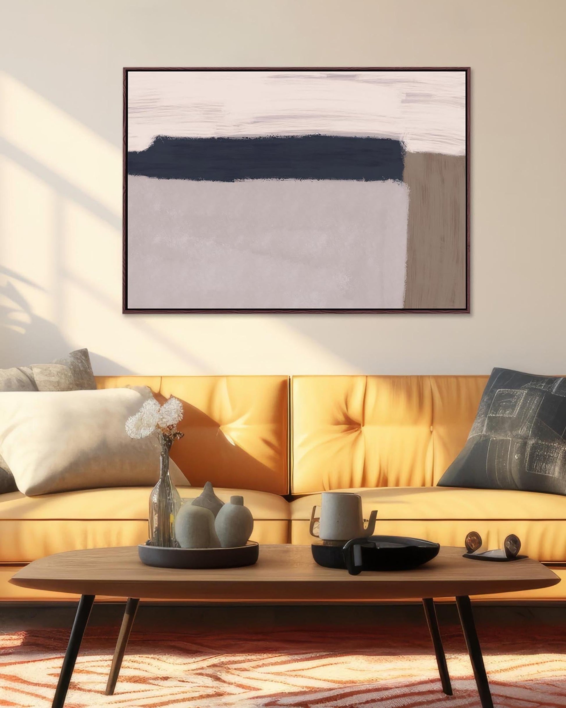 Living room with a yellow sofa, wooden coffee table, and abstract art on the wall.