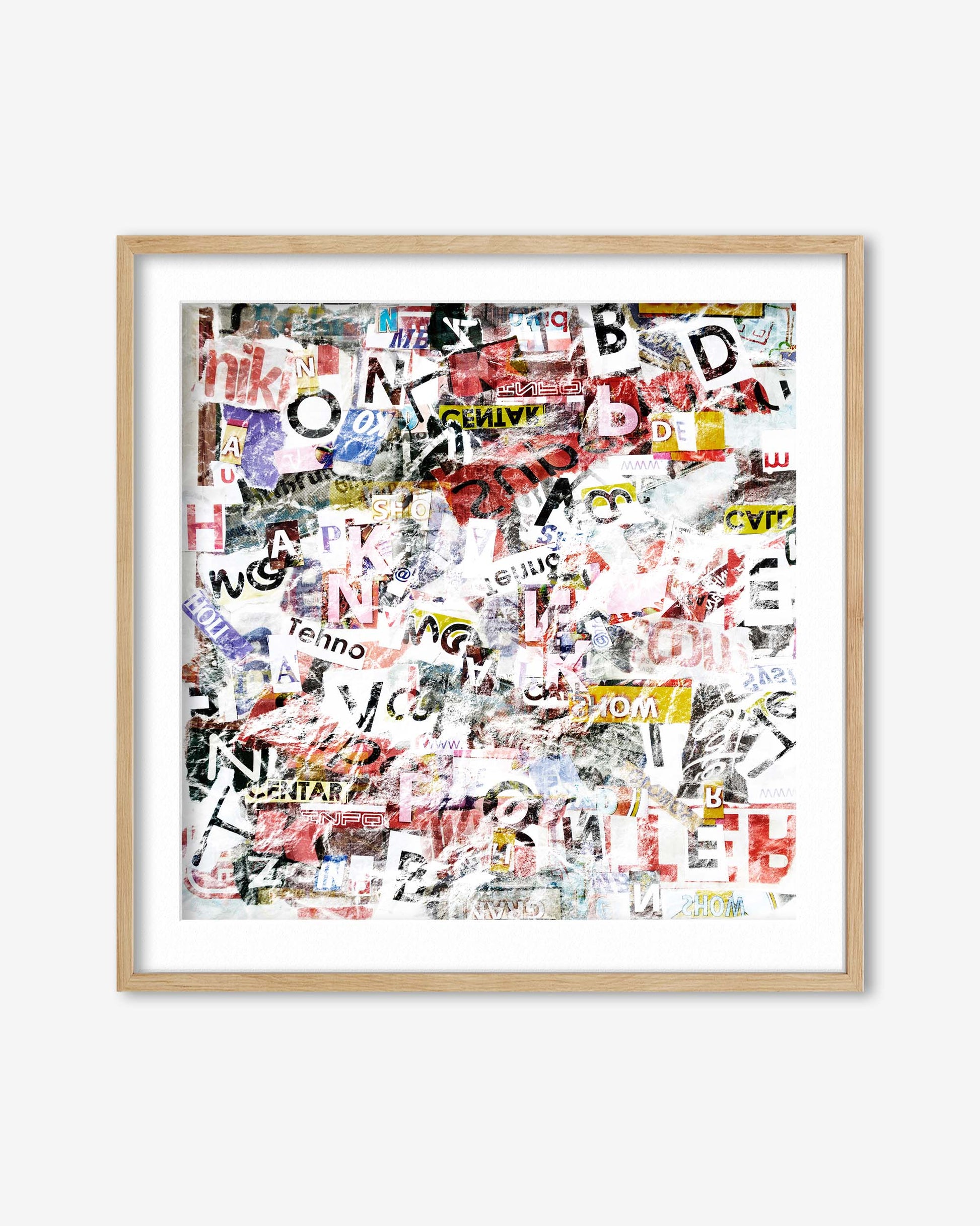 Framed collage of various printed letters and words on a white background