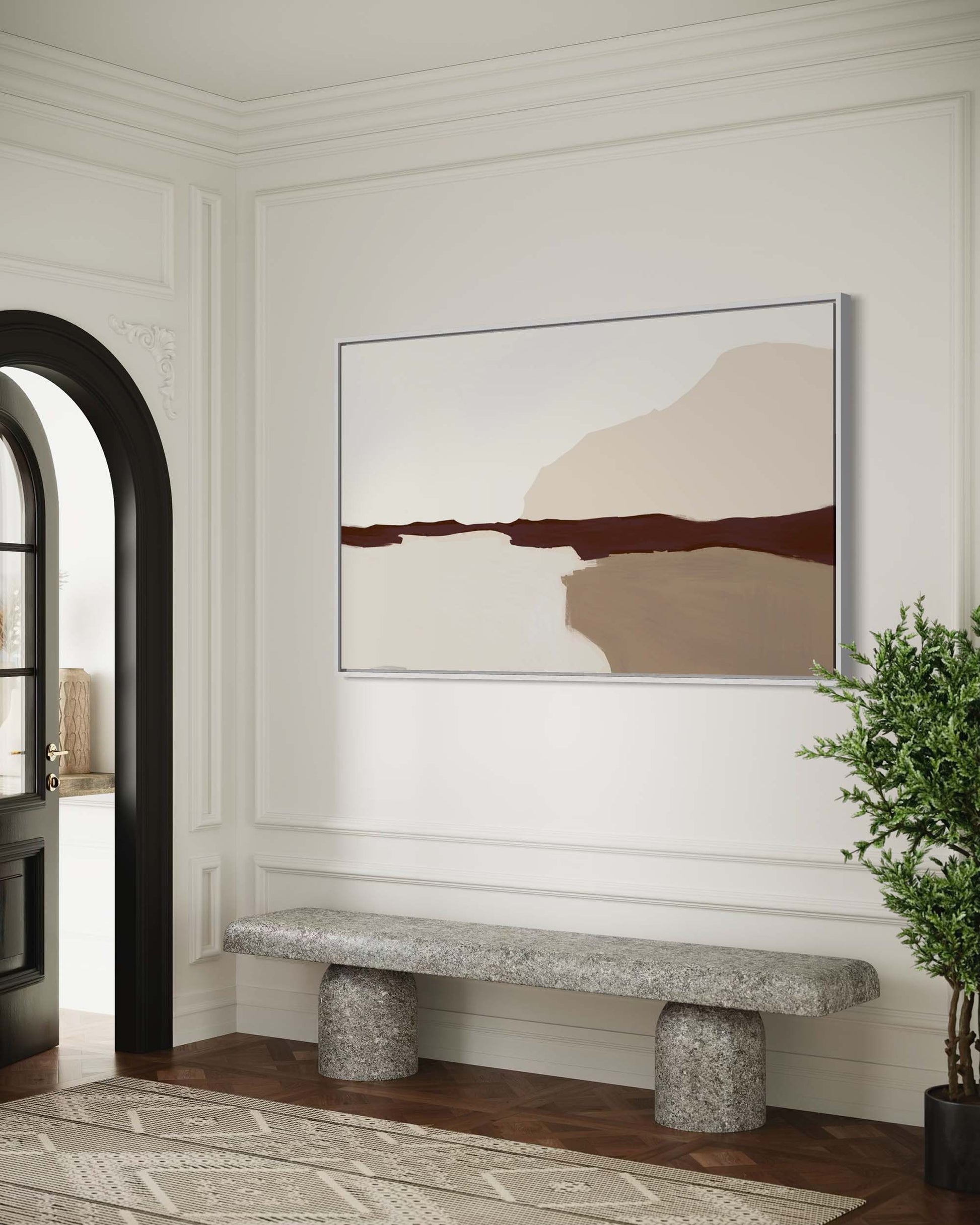 Modern interior with abstract art on the wall and a stone bench.