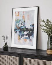 framed abstract artwork on sideboard