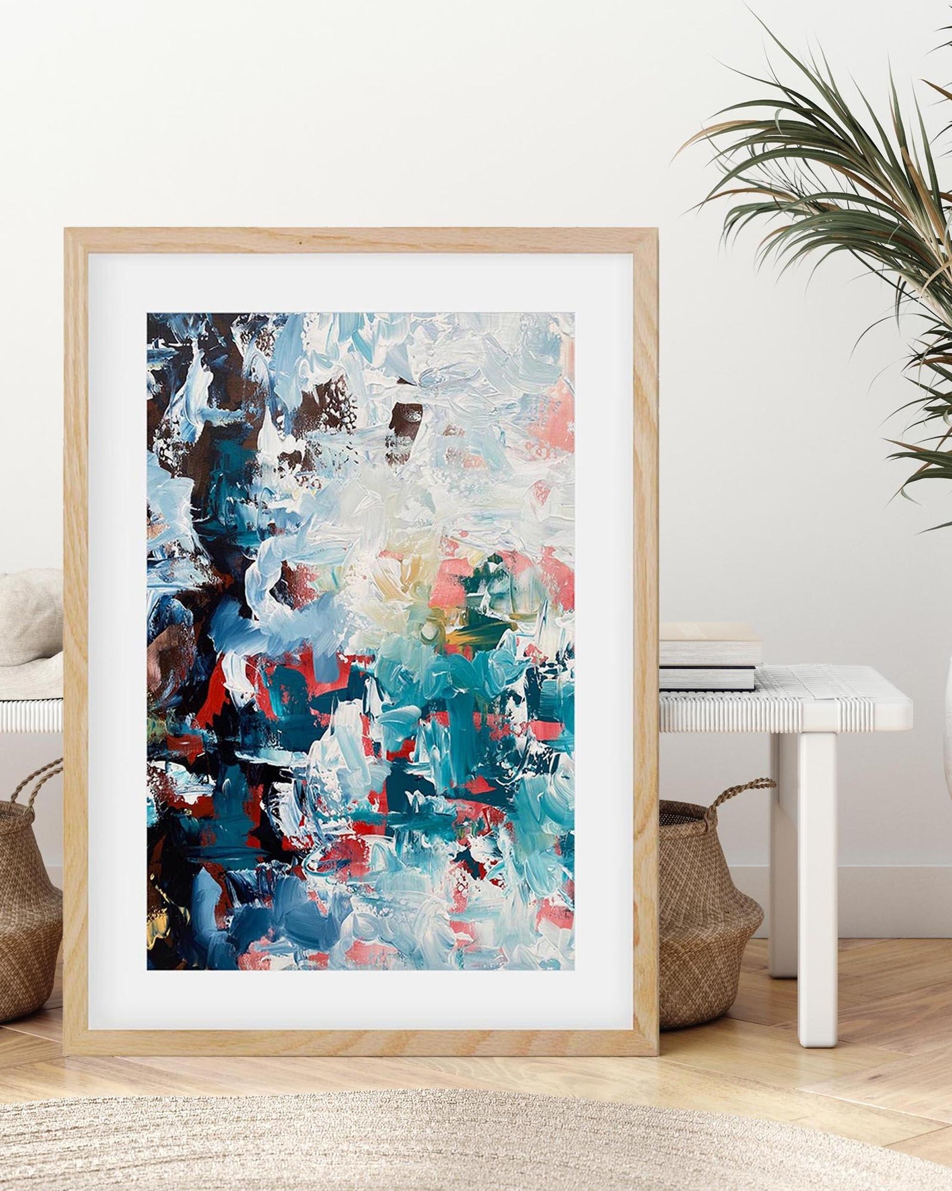 Framed abstract art print in a living room setting