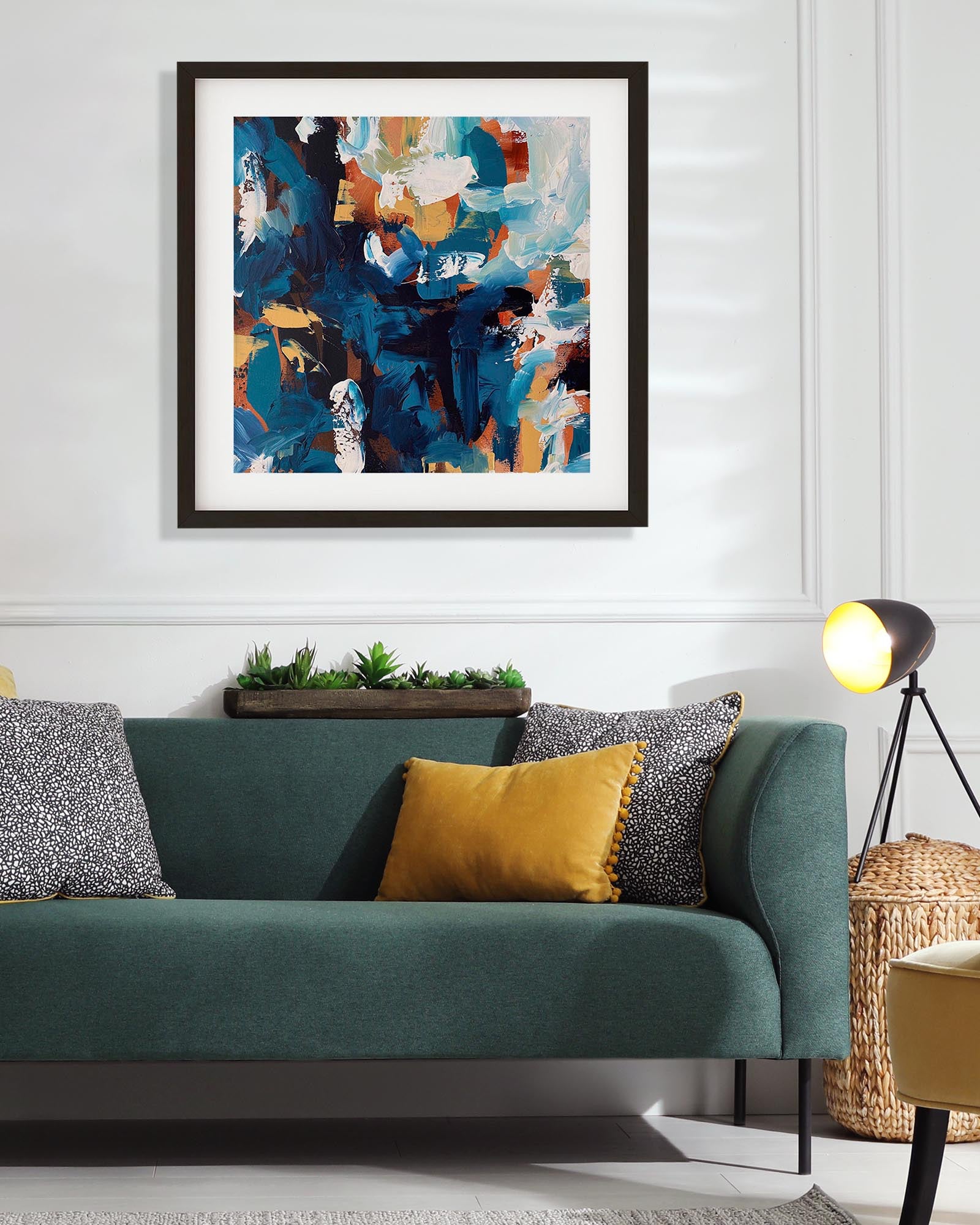 Modern living room with a teal sofa, abstract art, and decorative elements.