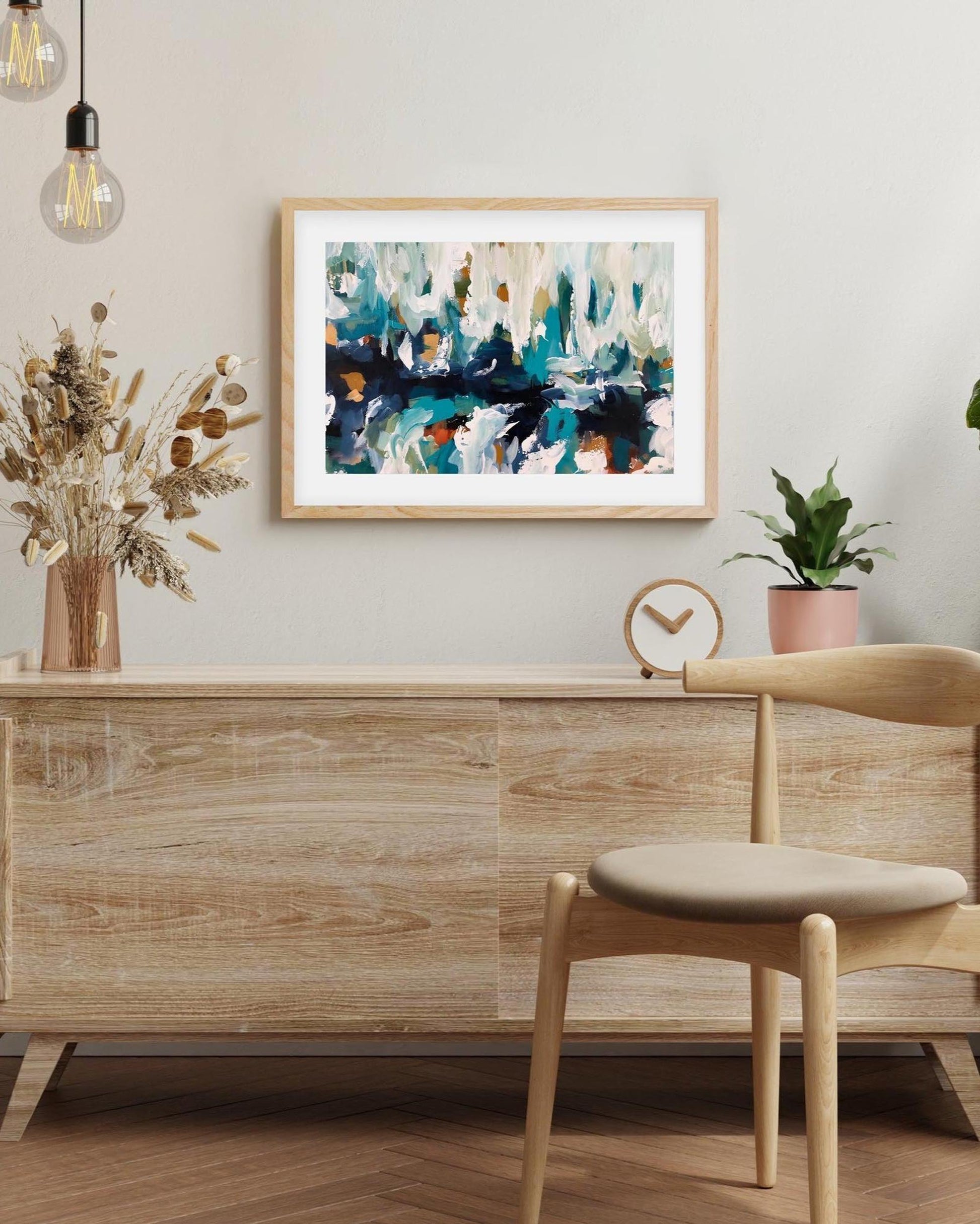 Modern interior with wooden furniture, abstract art, and decorative elements.