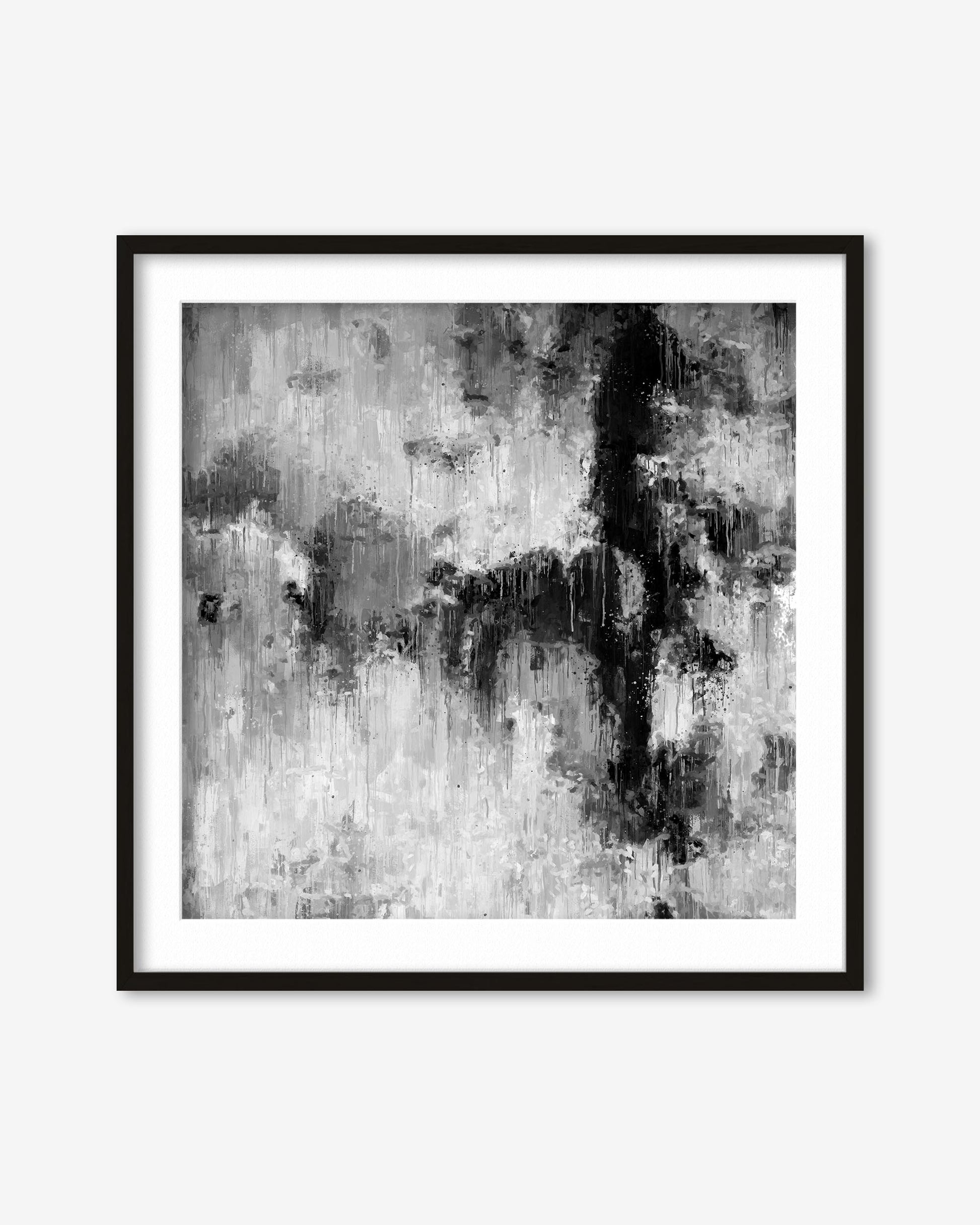 Framed black and white abstract art print on a white wall