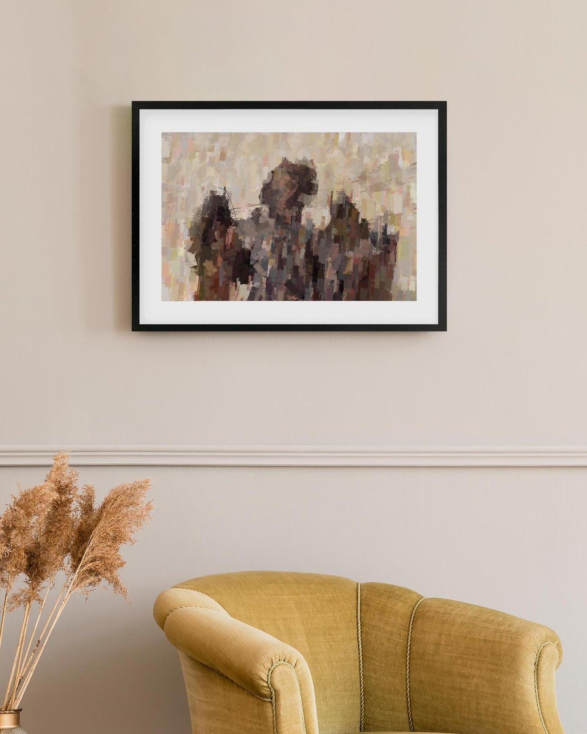 Framed abstract art piece on a wall above a yellow armchair.