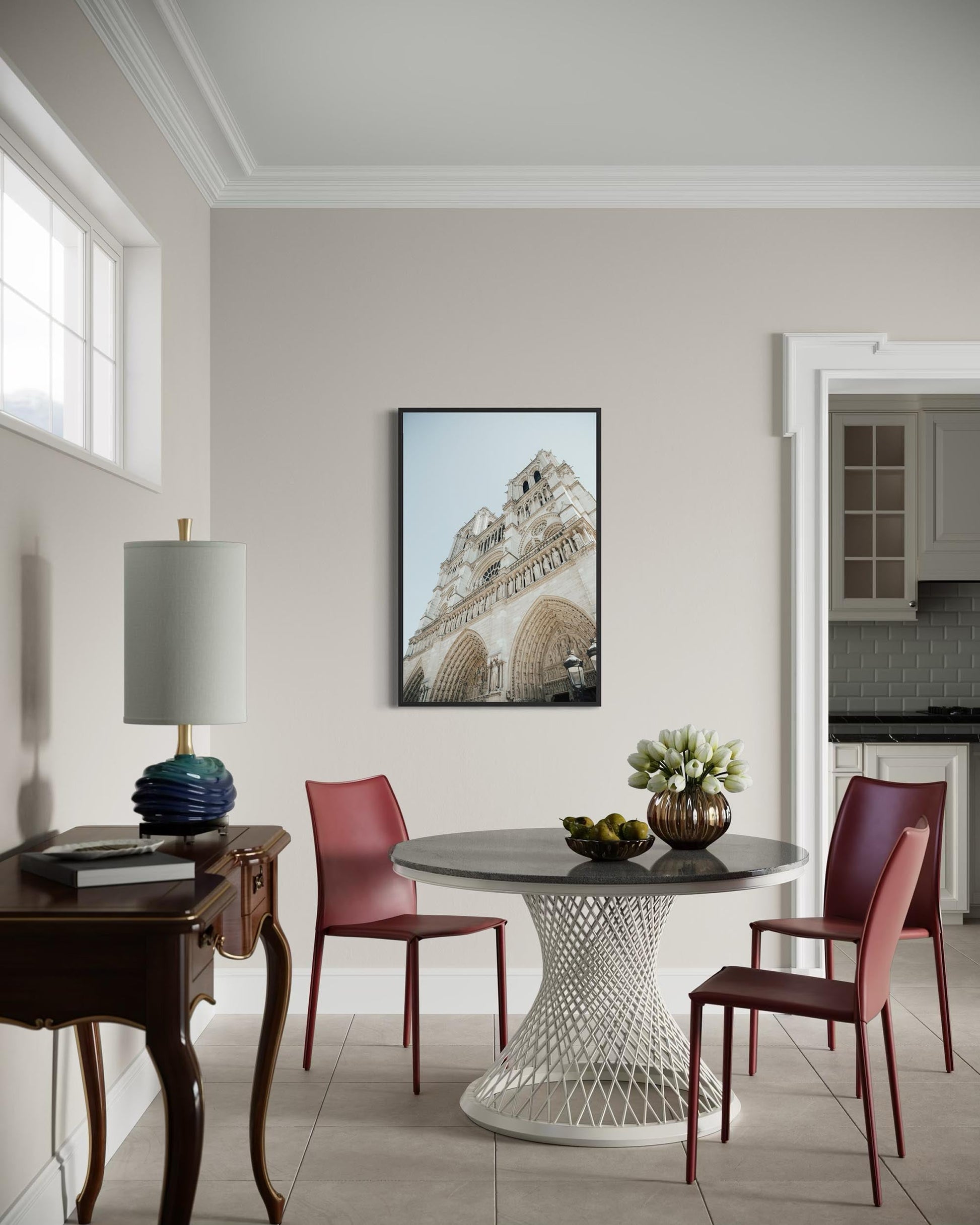 Dining room with a round table, red chairs, and a lamp.