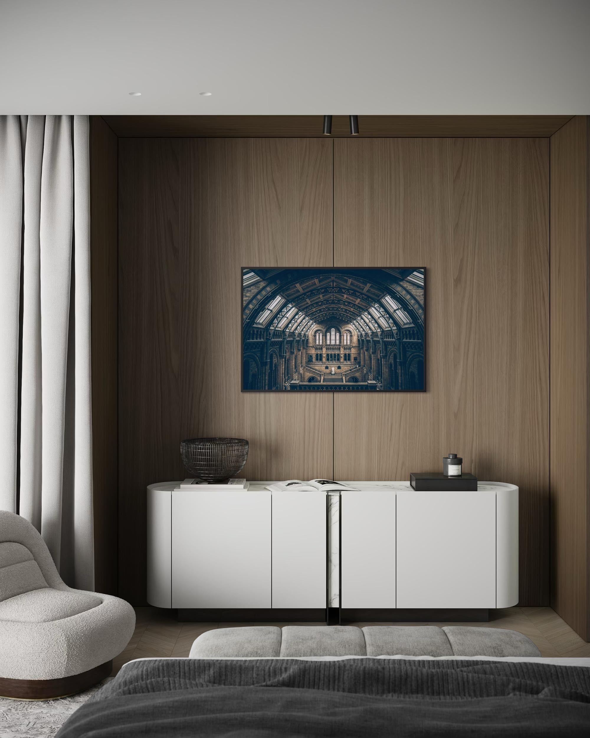 Modern living room with a white cabinet, gray sofa, and abstract painting on a wooden wall.