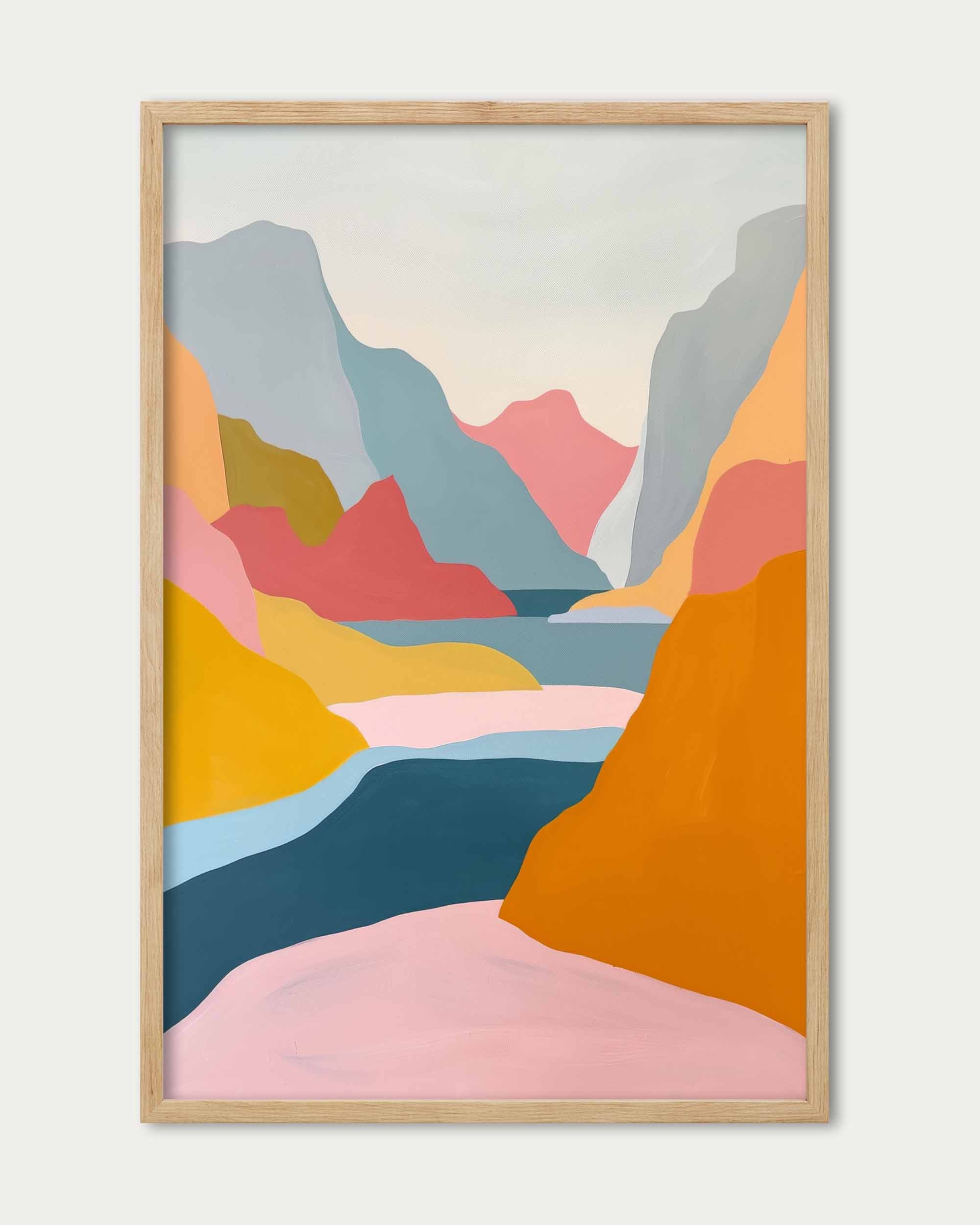 Framed abstract artwork of colorful mountains on a white wall