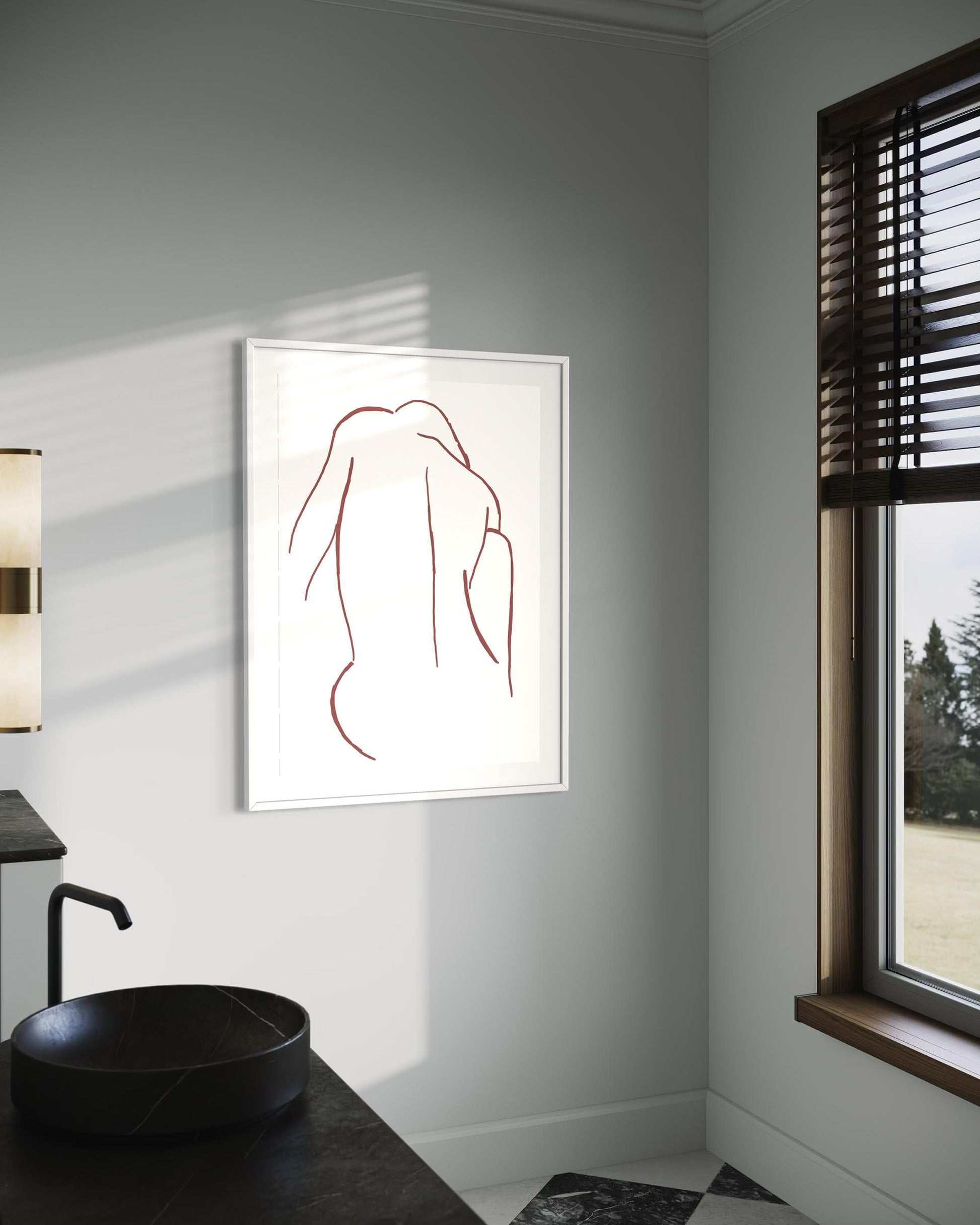 Minimalist line art print on a wall in a modern bathroom.