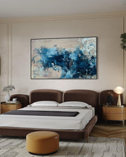 Modern bedroom with a large abstract painting on the wall above a bed.