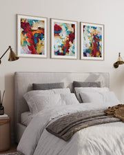 Bedroom with a bed, abstract art on the wall, and side tables.