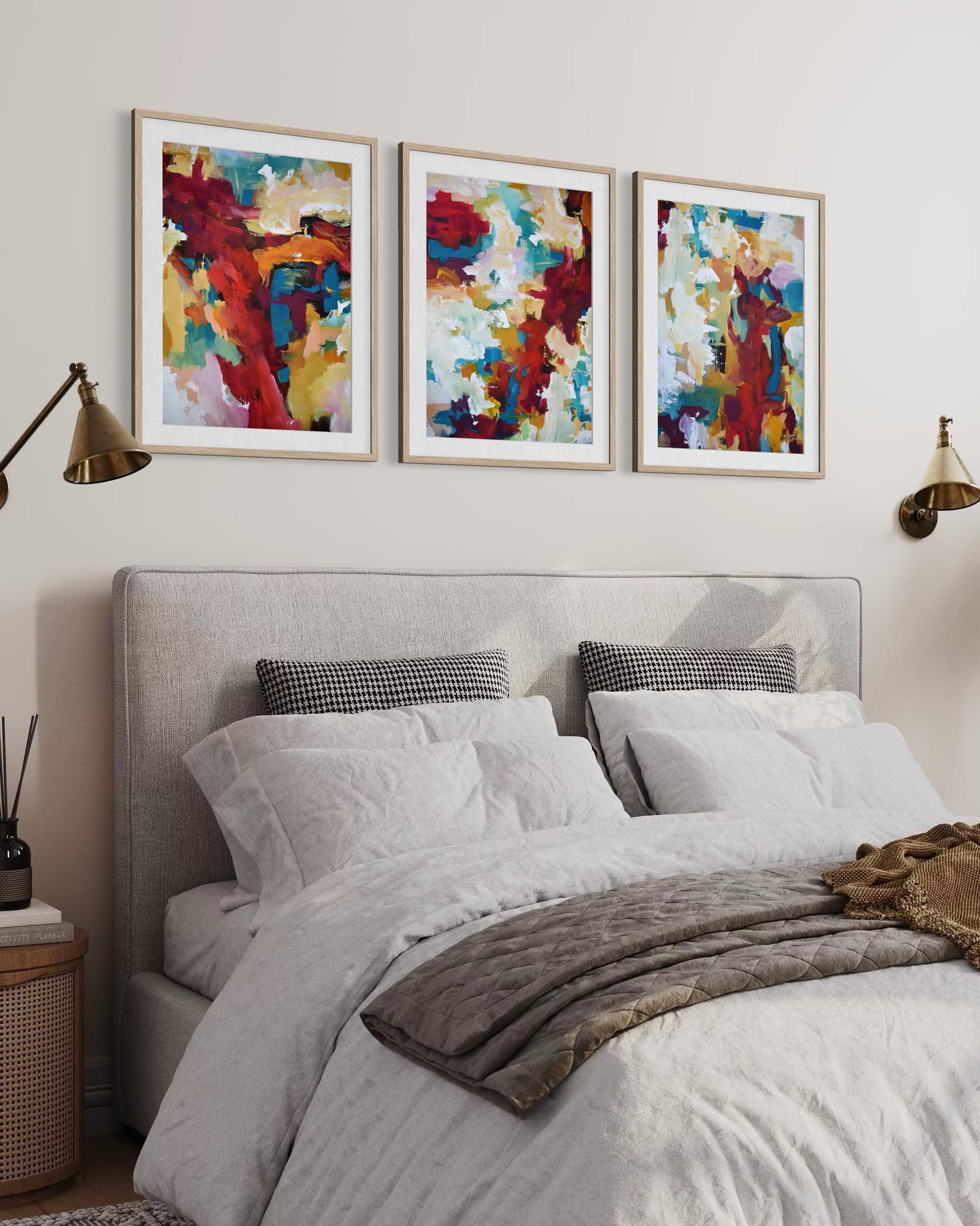 Bedroom with a bed, abstract art on the wall, and side tables.