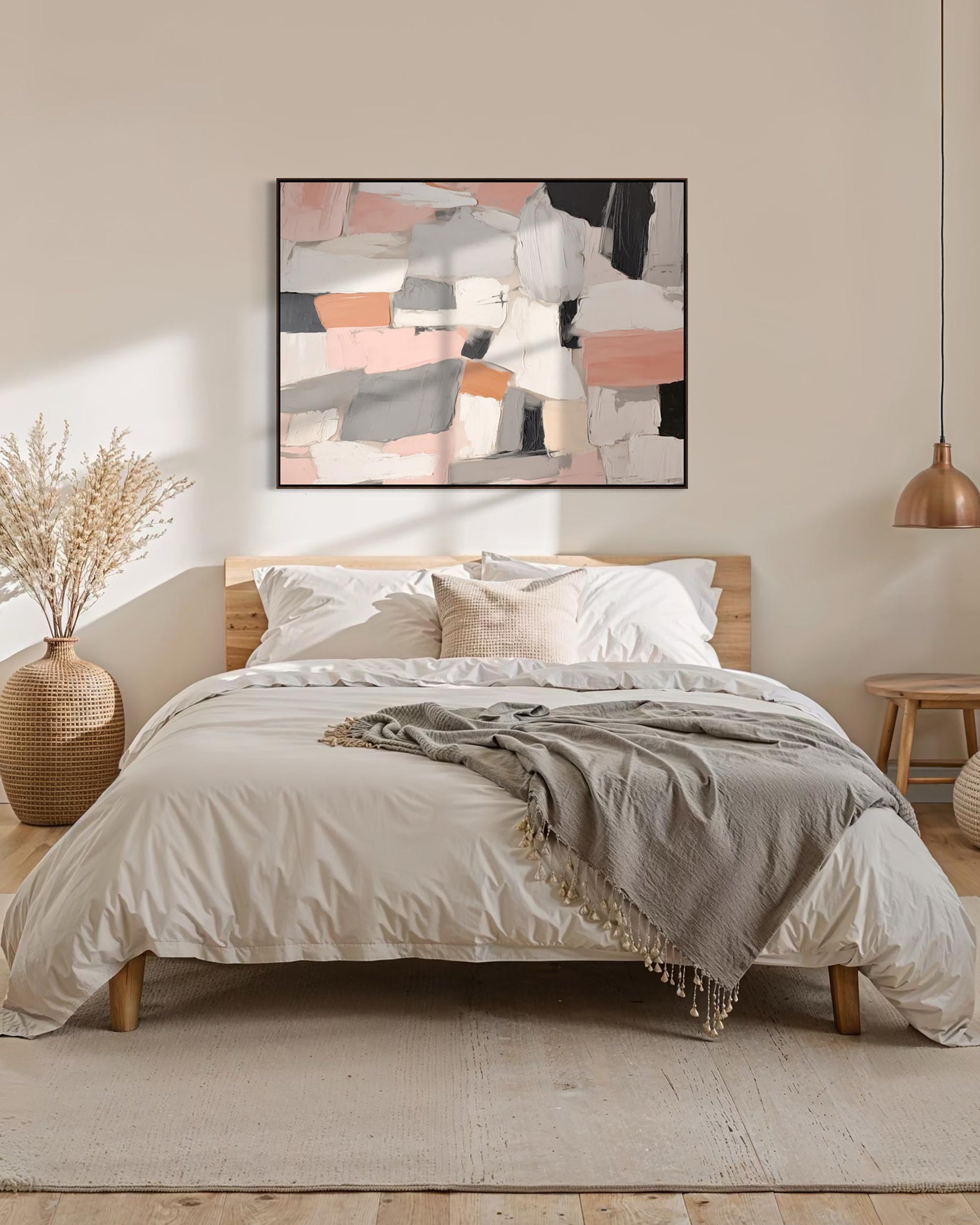 Bedroom with abstract art on the wall, neutral bedding, and decorative elements.