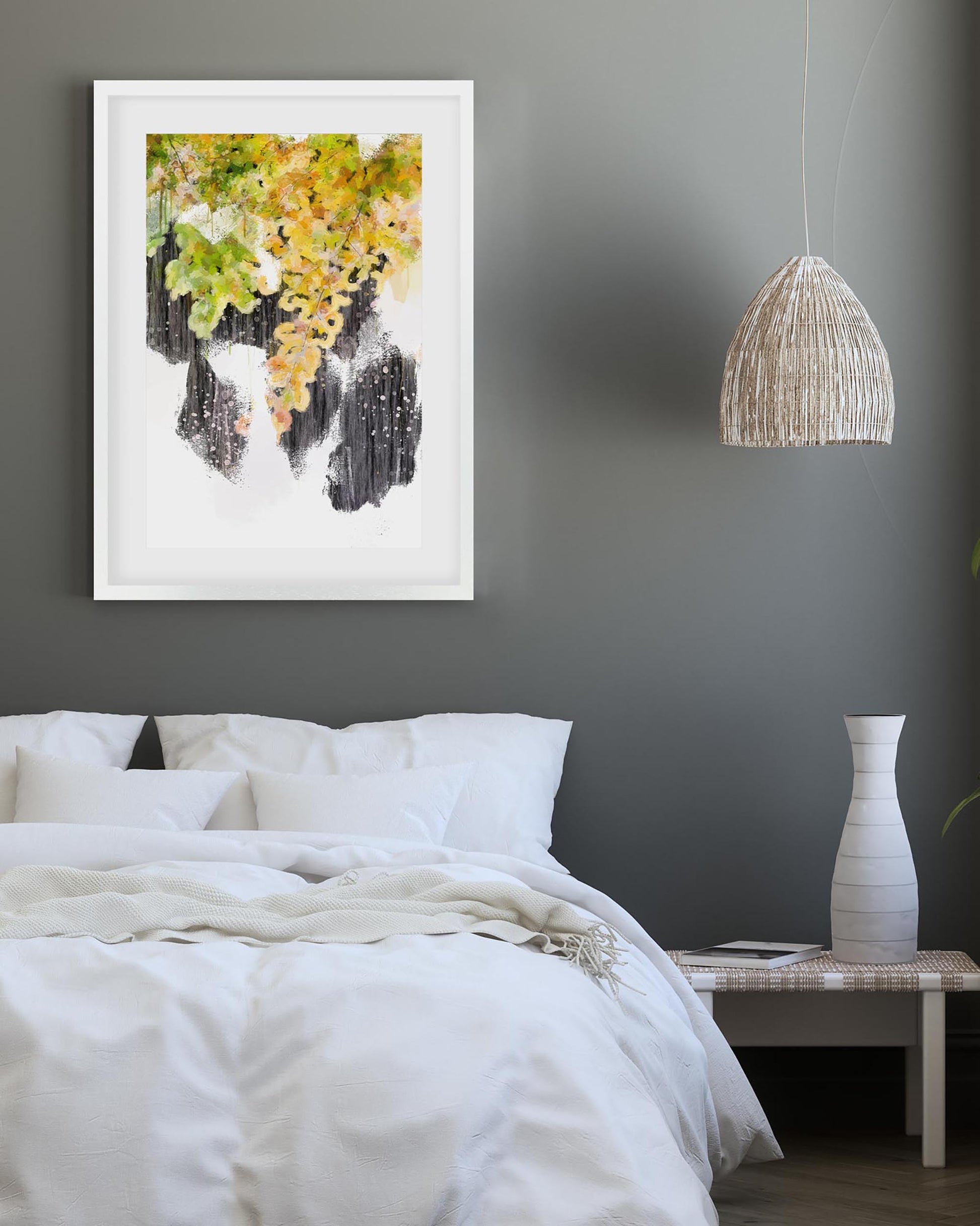 Modern bedroom with a bed, framed artwork, pendant light, and vase.