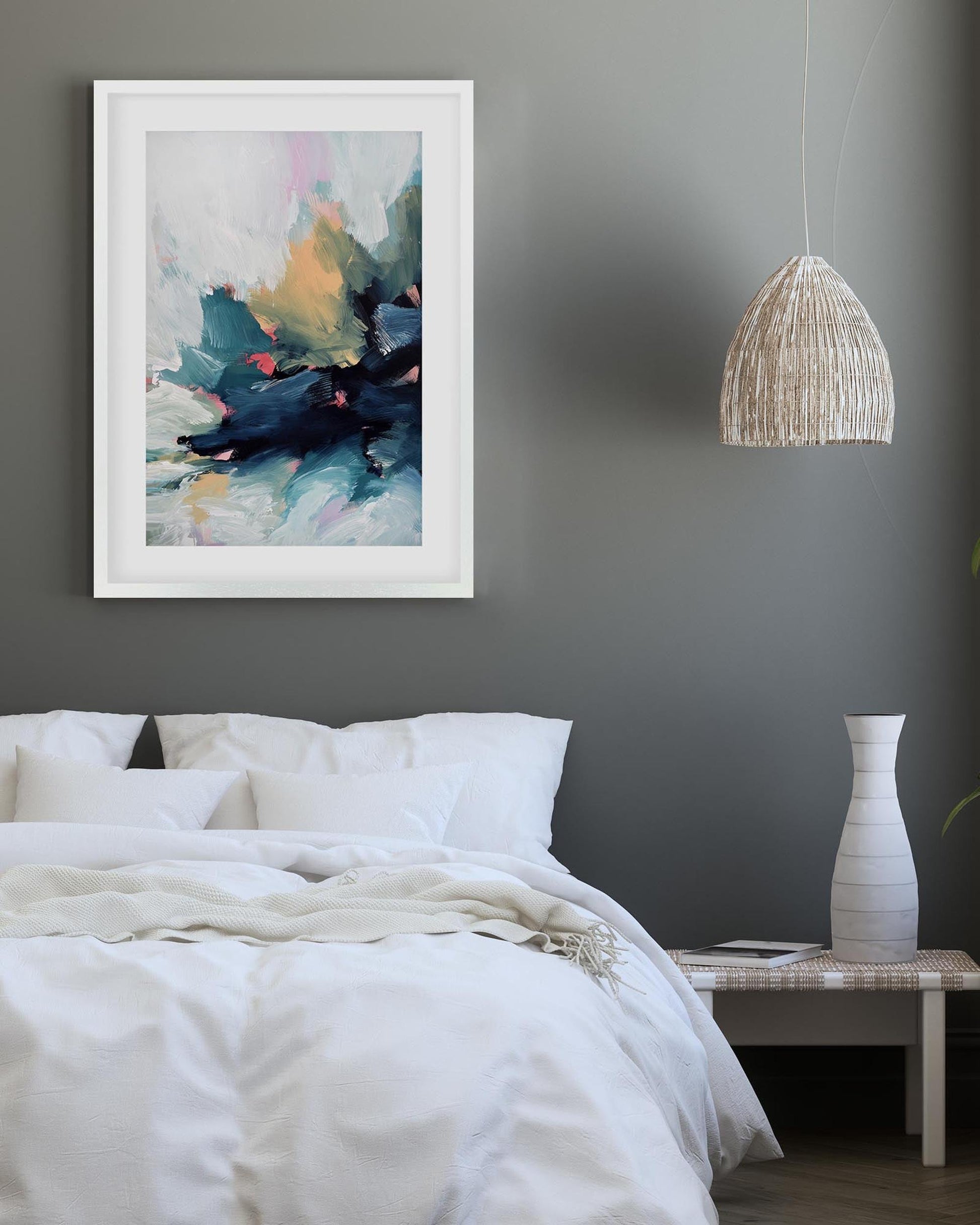 Bedroom interior with abstract art on the wall, pendant light, and vase.