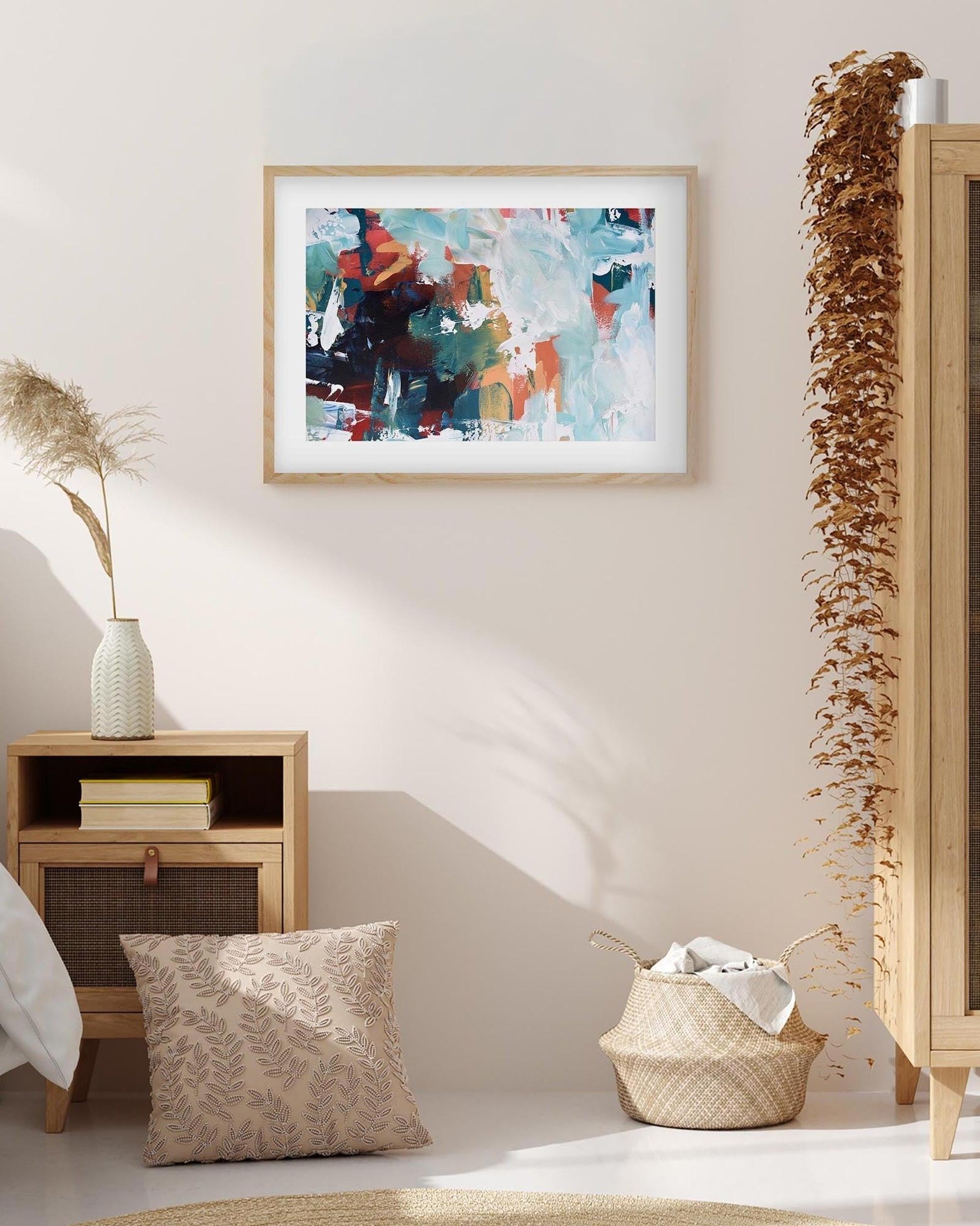 abstract art print in oak frame on a wall in beige bedroom