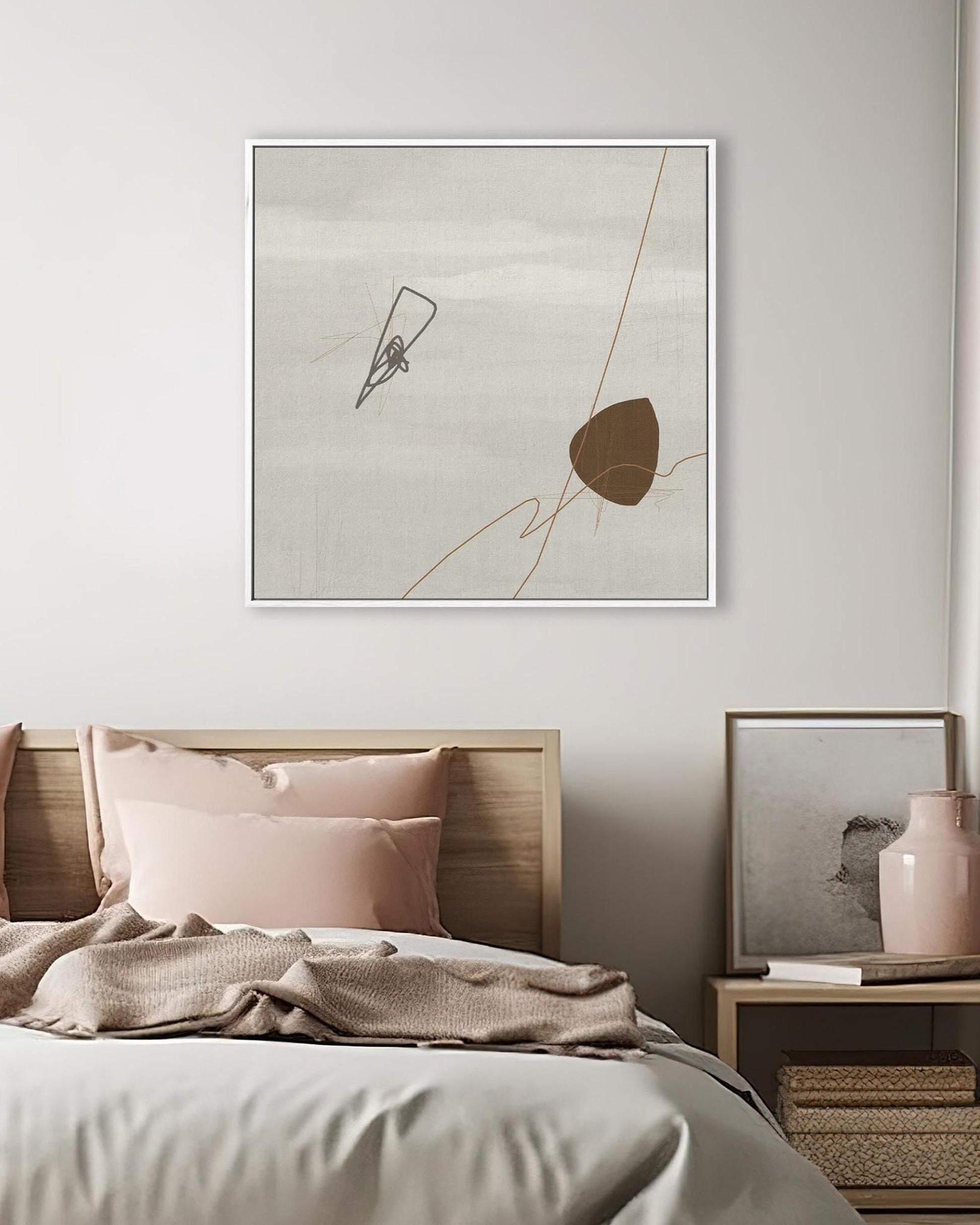 Modern bedroom with abstract art on the wall and a vase on a nightstand.