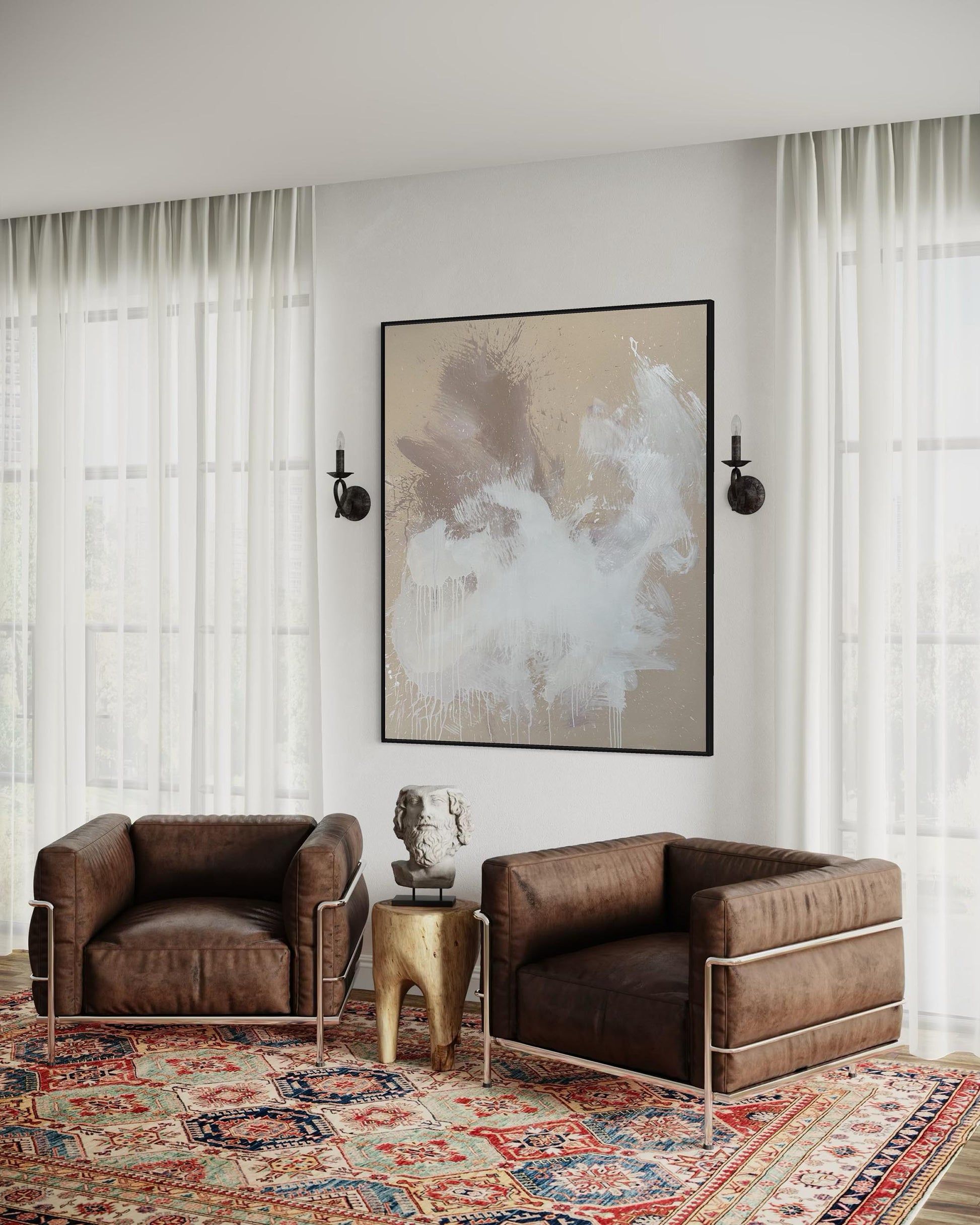 Modern living room with two brown leather chairs, a gold side table, and abstract art on the wall.