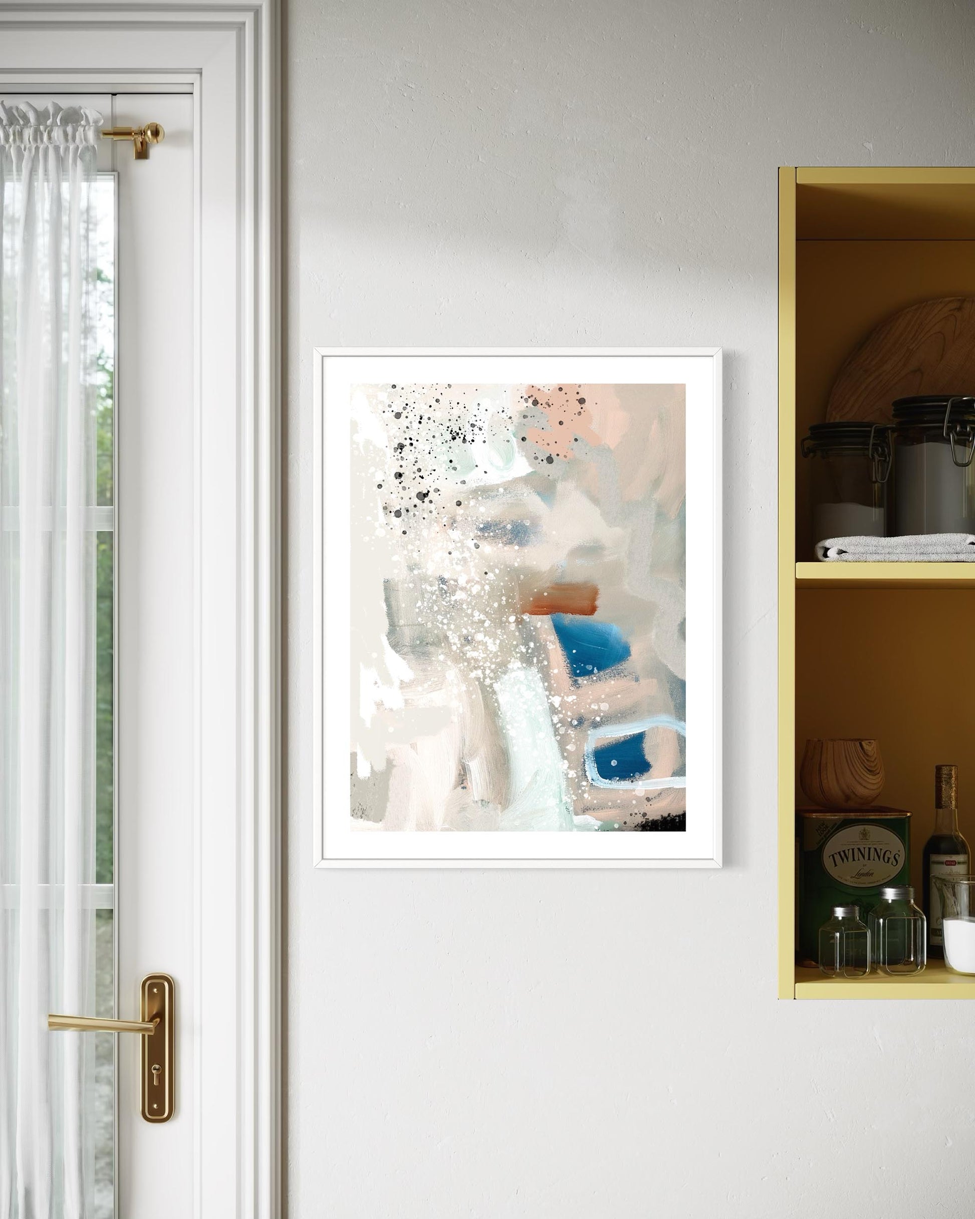 Framed abstract art print on a wall next to a door and shelf.