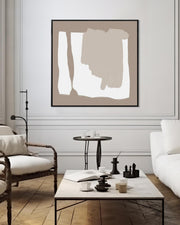 Modern living room with abstract art, chairs, and a coffee table.