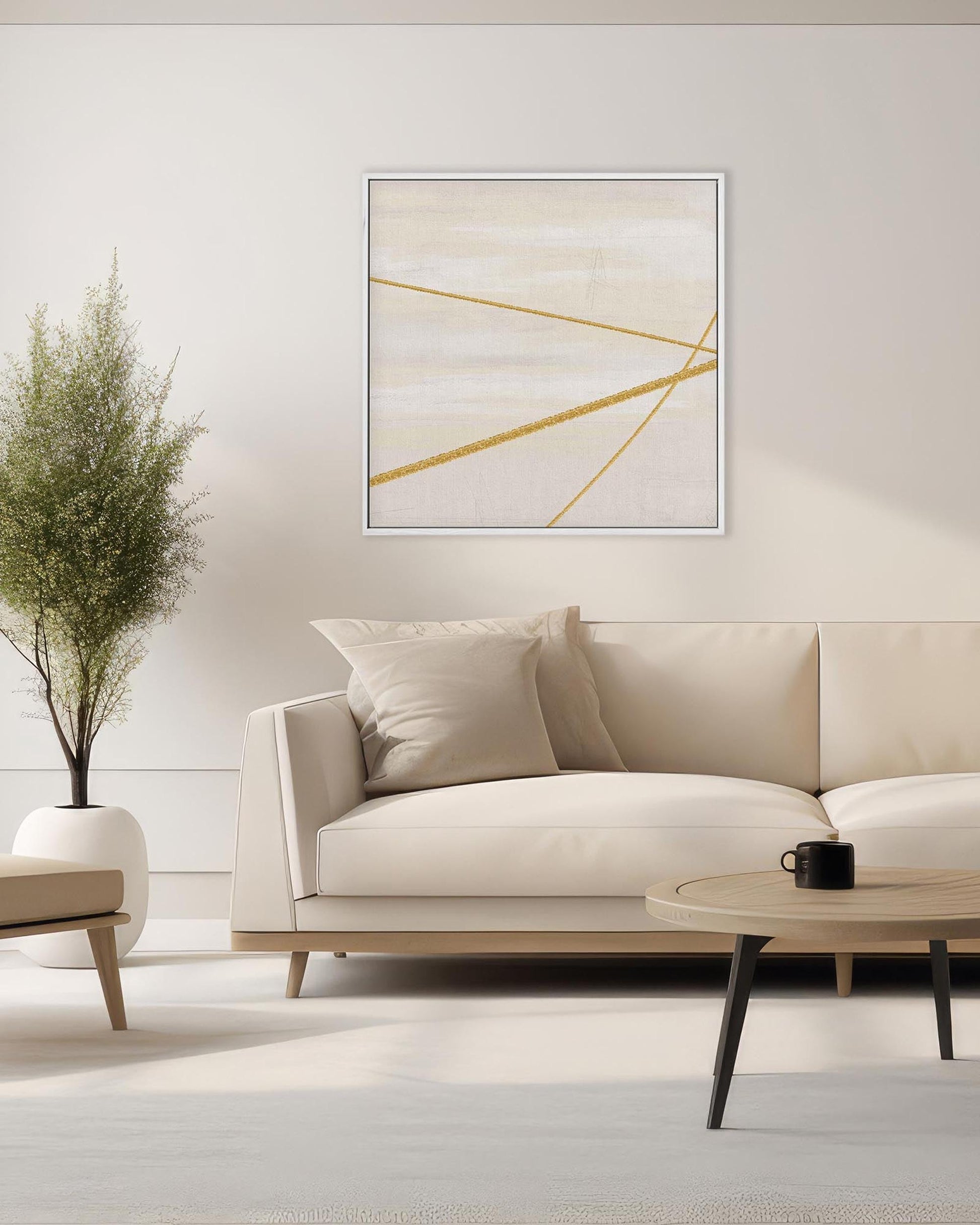 Modern living room with a beige sofa, abstract art, and a plant.