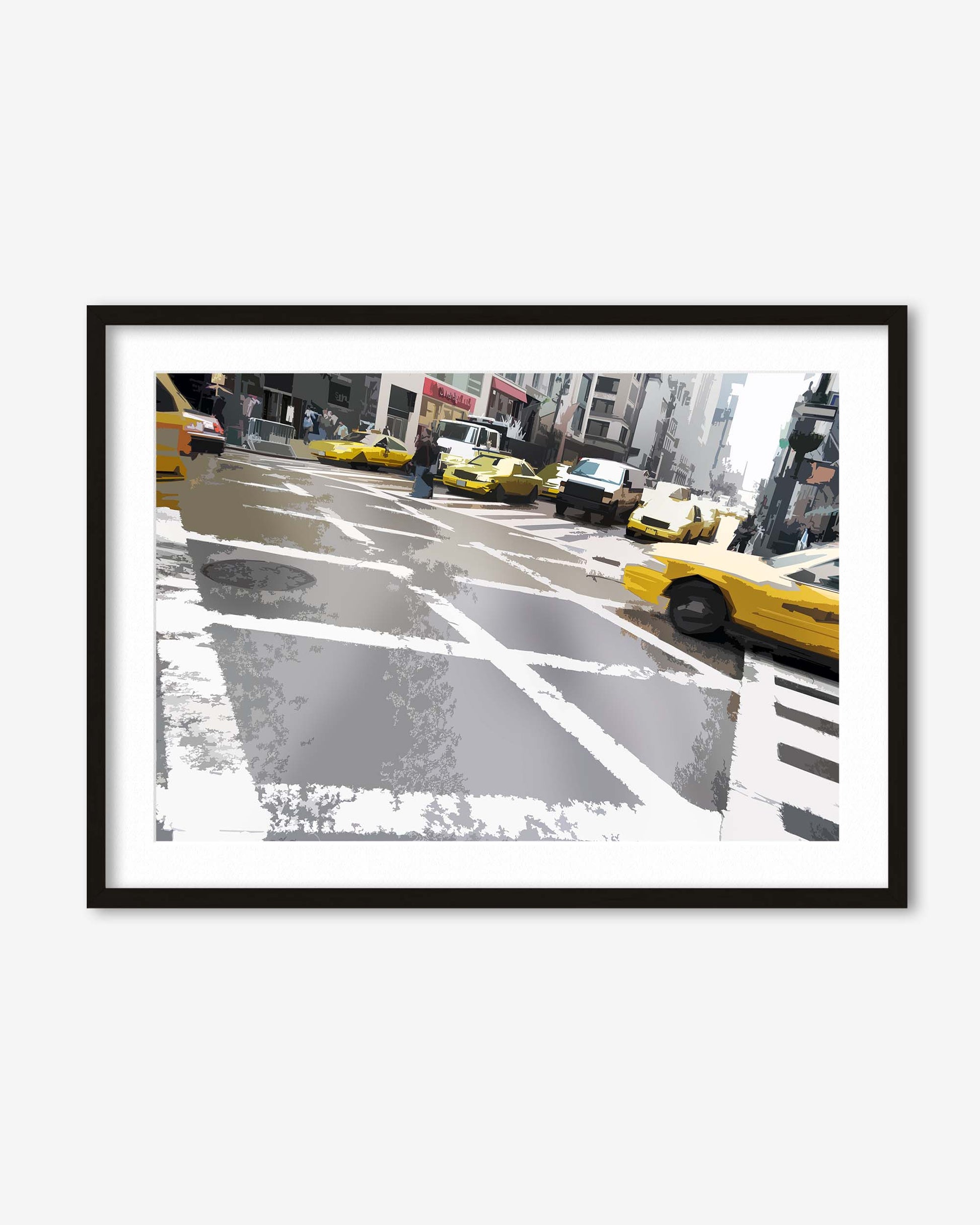 Framed photograph of a city street with yellow taxis on a white wall