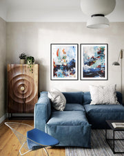 Modern living room with blue sofa, abstract art, and decorative items.
