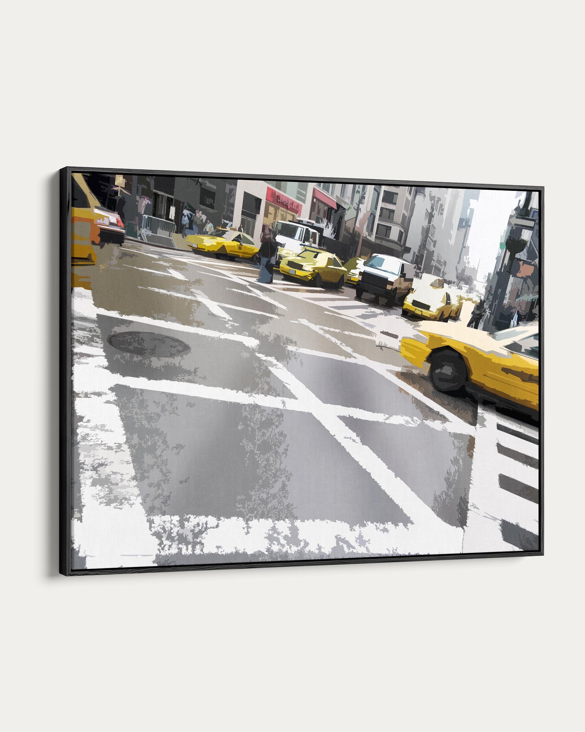 Framed artwork of a city street with yellow taxis and pedestrians.