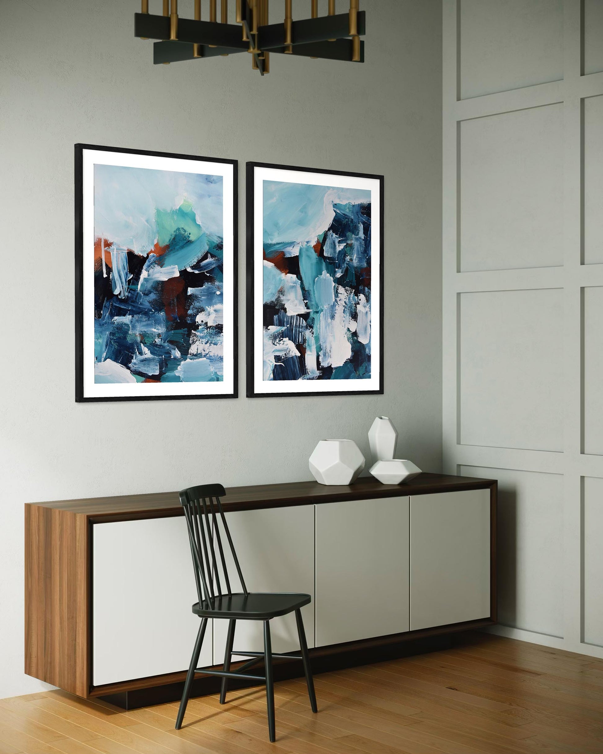 Modern interior with abstract art on the wall, a console table, and a chair.