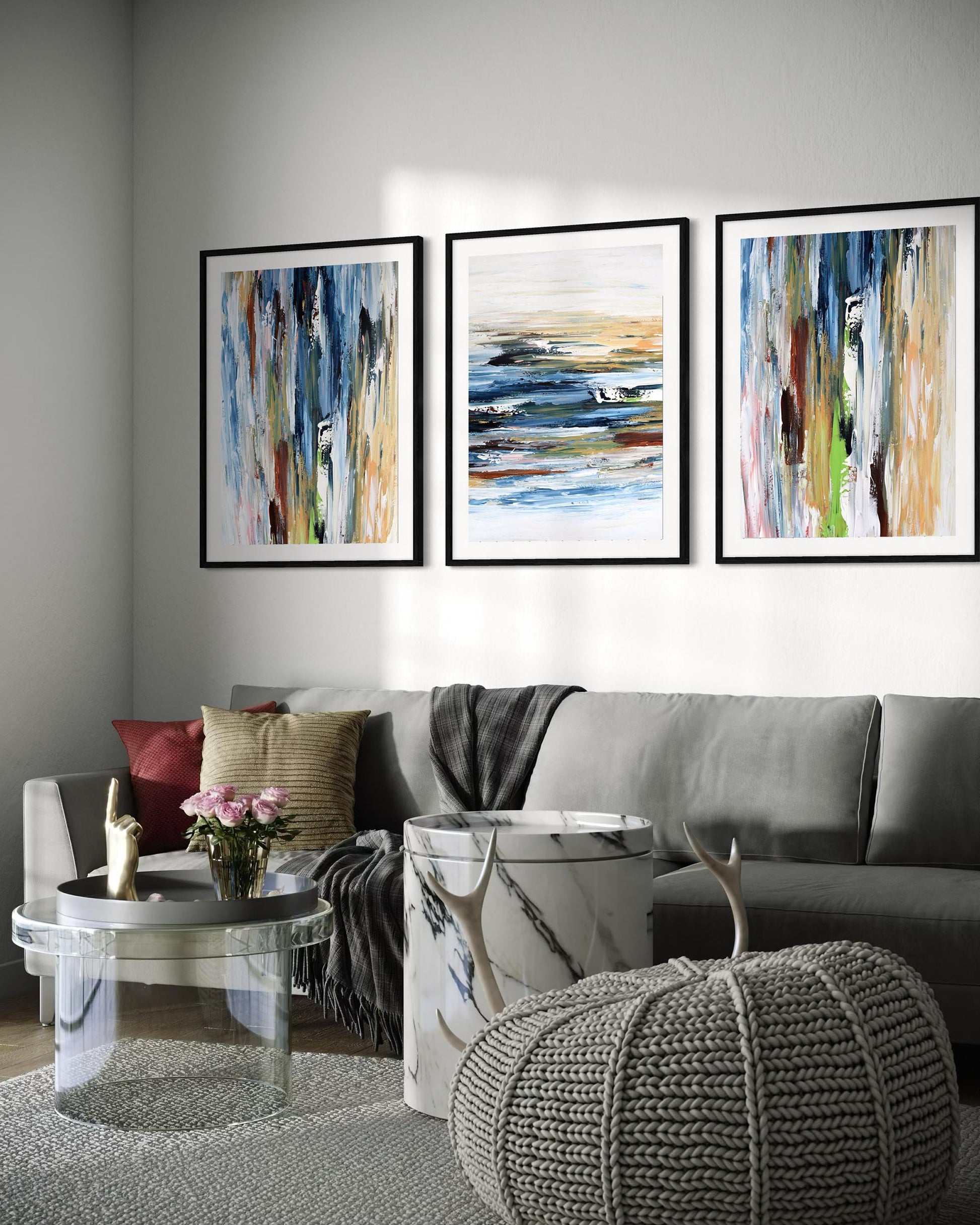 Living room with gray sectional sofa, abstract art on the wall, and decorative items.