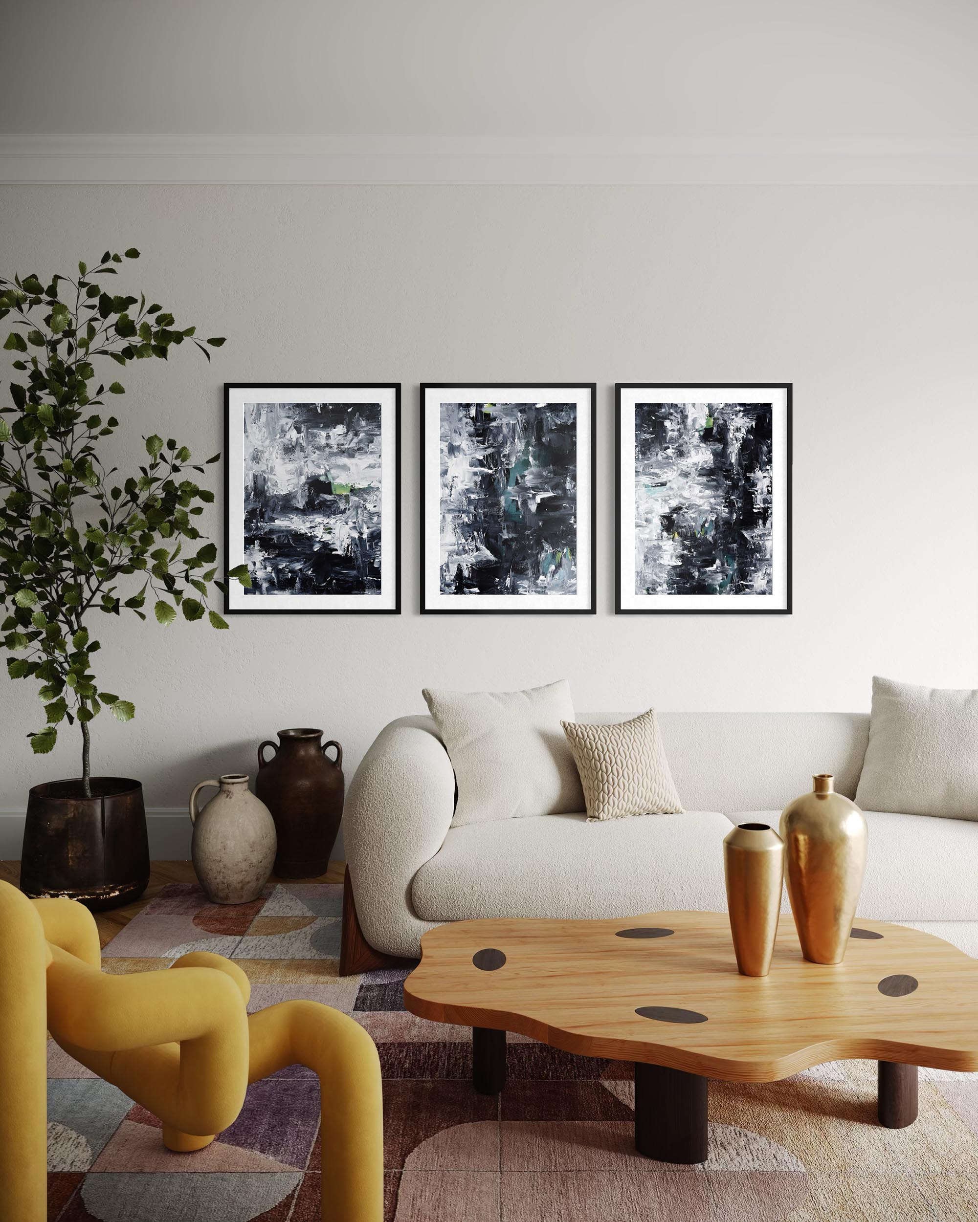 Modern living room with a white sofa, yellow chair, wooden coffee table, and abstract art on the wall.
