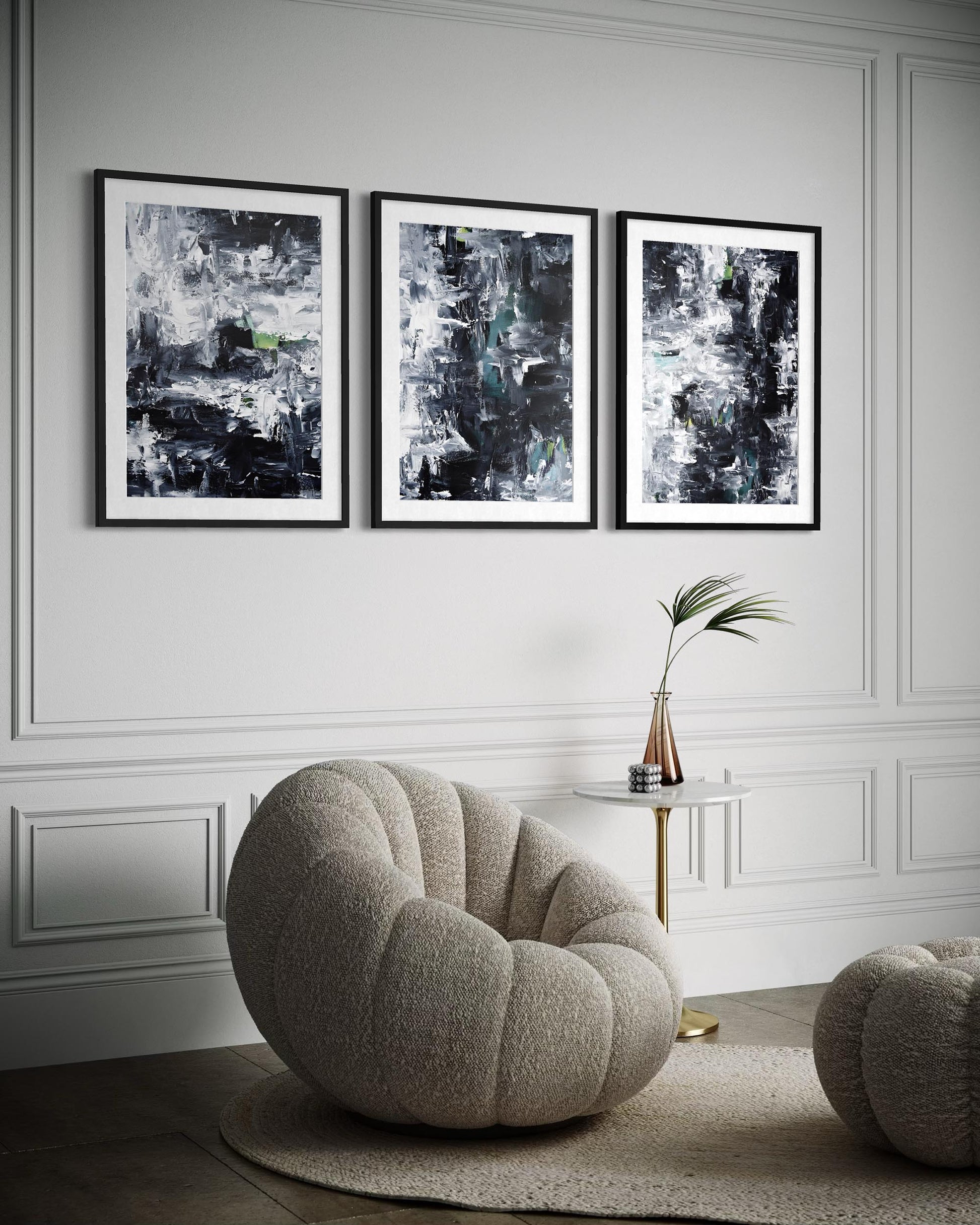 Modern living room with abstract art on the wall and a round chair.